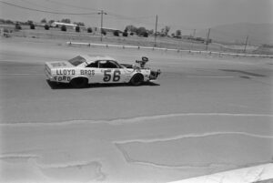 The Ford Fairlane, with 'Lloyd Bros Ford' with 'Frank Capua, 56' written on the door, driven by American actor Paul Newman, a movie camera mounted on the hood, driving on the set of 'Winning', filmed at the Riverside International Raceway in Moreno Valley, California, August 1968. Directed by James Goldstone, the motorsports drama starred Newman as Frank Capua. (Photo by Michael Ochs Archives/Getty Images)