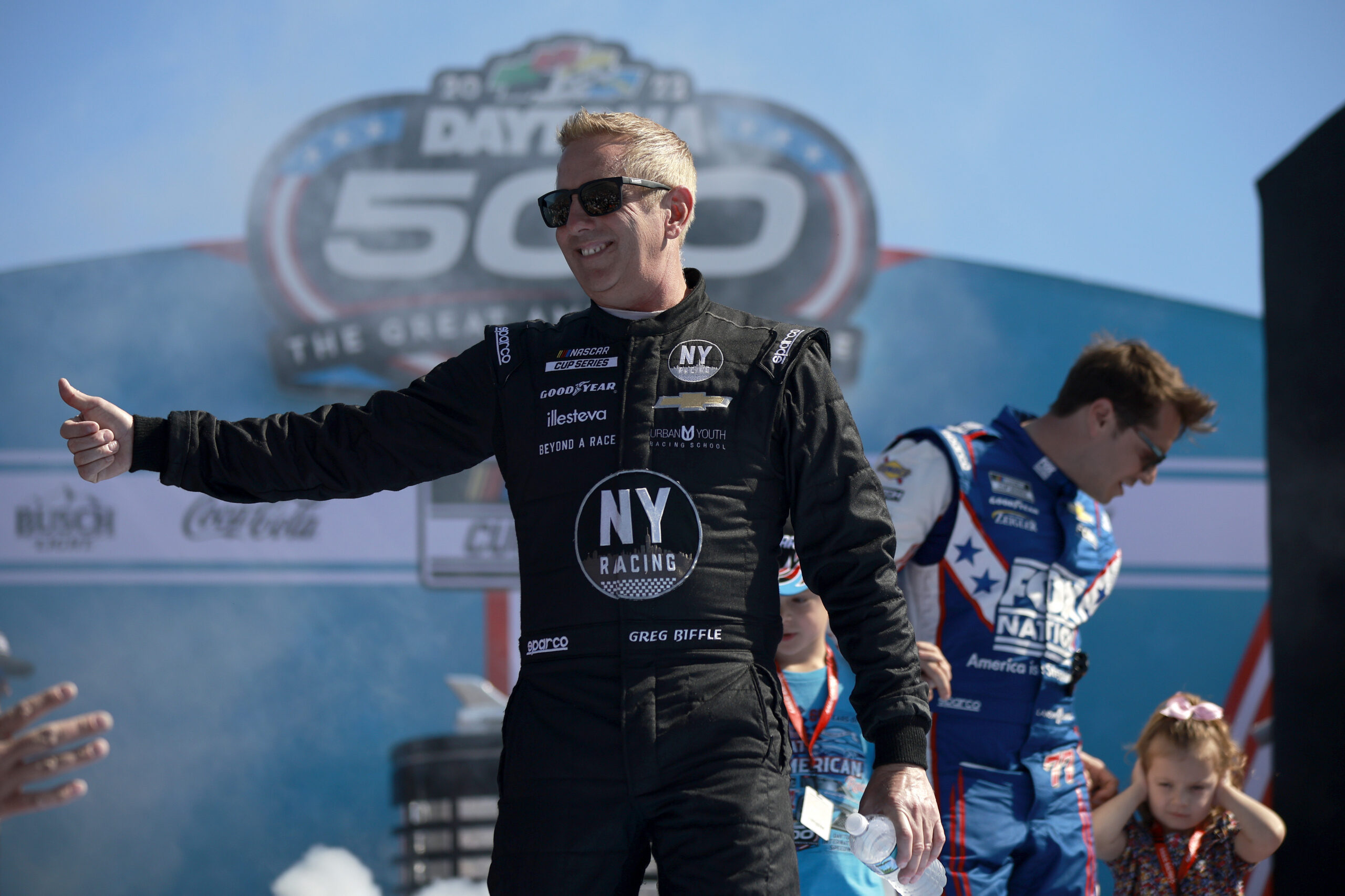 DAYTONA BEACH, FLORIDA - FEBRUARY 20: Greg Biffle, driver of the #44 Grambling State University Chevrolet, waves to fans onstage during driver intros prior to the NASCAR Cup Series 64th Annual Daytona 500 at Daytona International Speedway on February 20, 2022 in Daytona Beach, Florida. (Photo by Jared C. Tilton/Getty Images)