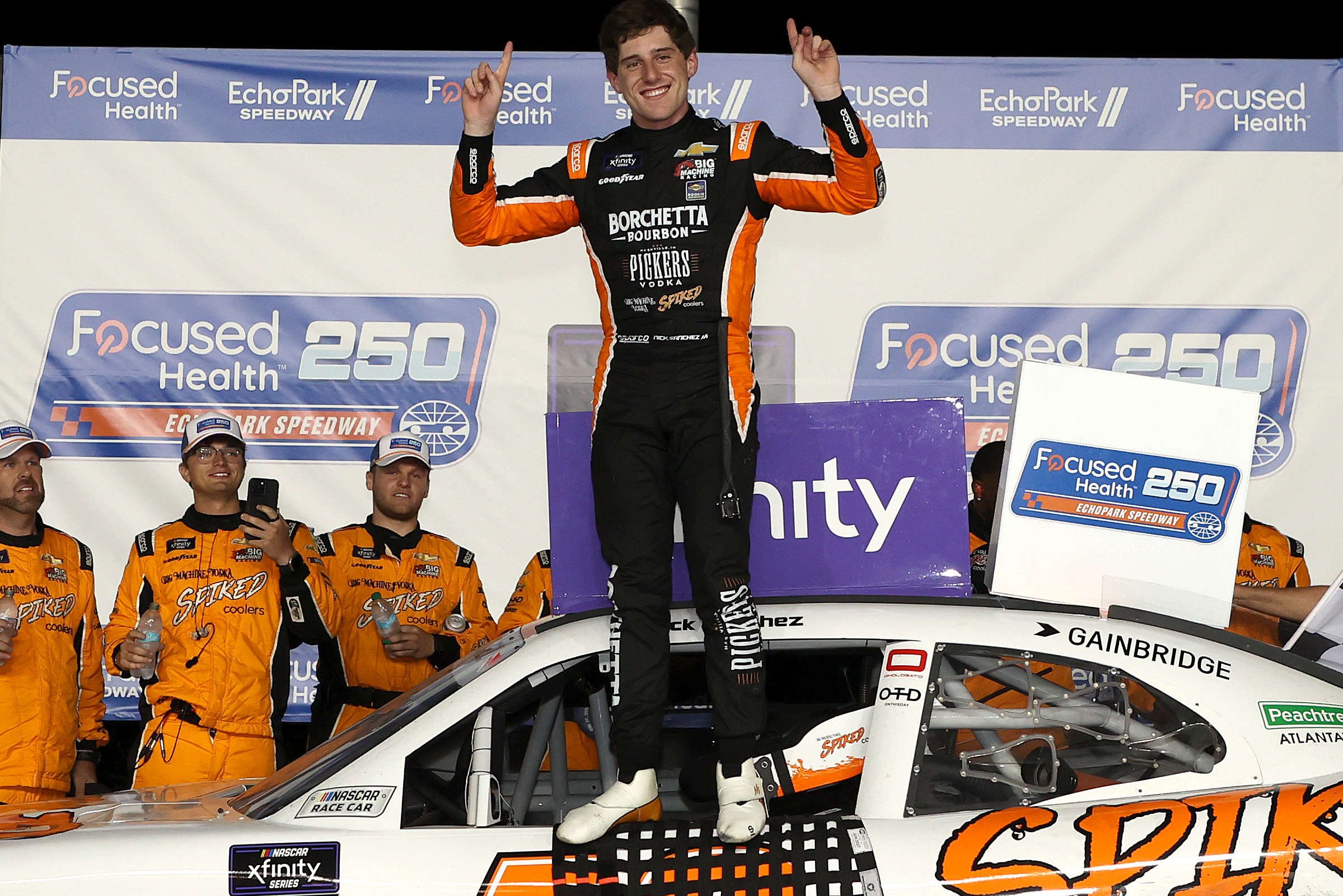 HAMPTON, GEORGIA - JUNE 27: Nick Sanchez, driver of the #48 Big Machine Spiked Coolers Chevrolet, celebrates in victory lane after winning the NASCAR Xfinity Series Focused Health 250 at Echo Park Speedway on June 27, 2025 in Hampton, Georgia. (Photo by Krista Jasso/Getty Images)