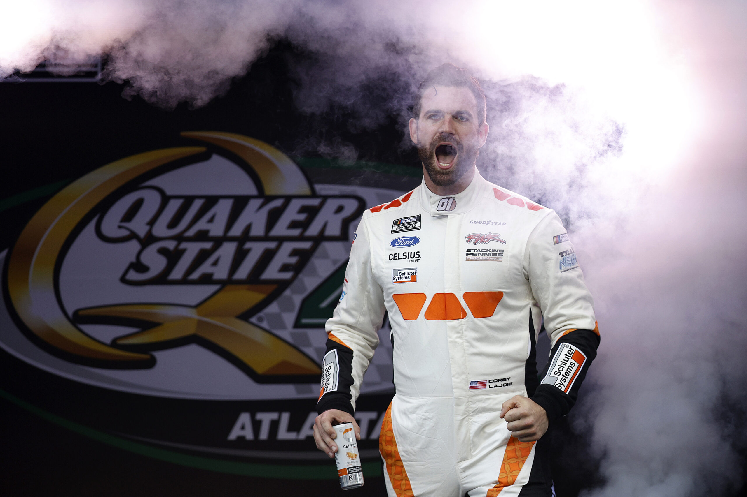 HAMPTON, GEORGIA - JUNE 28: Corey LaJoie, driver of the #01 Schluter Systems Ford, walks onstage during driver intros prior to the NASCAR Cup Series Quaker State 400 Available at Walmart at Echo Park Speedway on June 28, 2025 in Hampton, Georgia. (Photo by Sean Gardner/Getty Images)