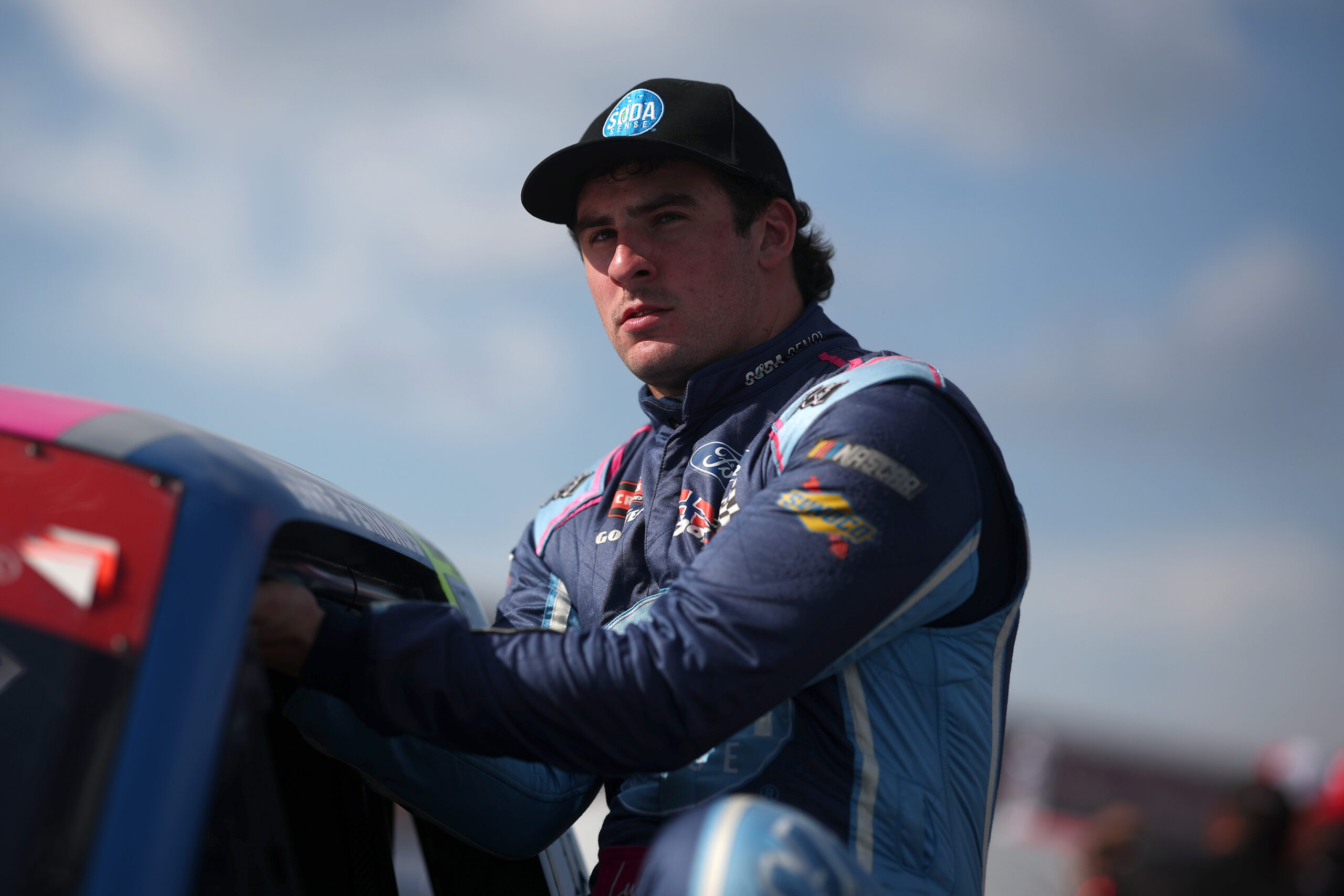 TALLADEGA, ALABAMA - OCTOBER 17: Luke Fenhaus, driver of the #66 Soda Sense Ford, enters his truck for the NAStruck Craftsman Truck Series Love's RV Stop 225 at Talladega Superspeedway on October 17, 2025 in Talladega, Alabama. (Photo by Chris Graythen/Getty Images)