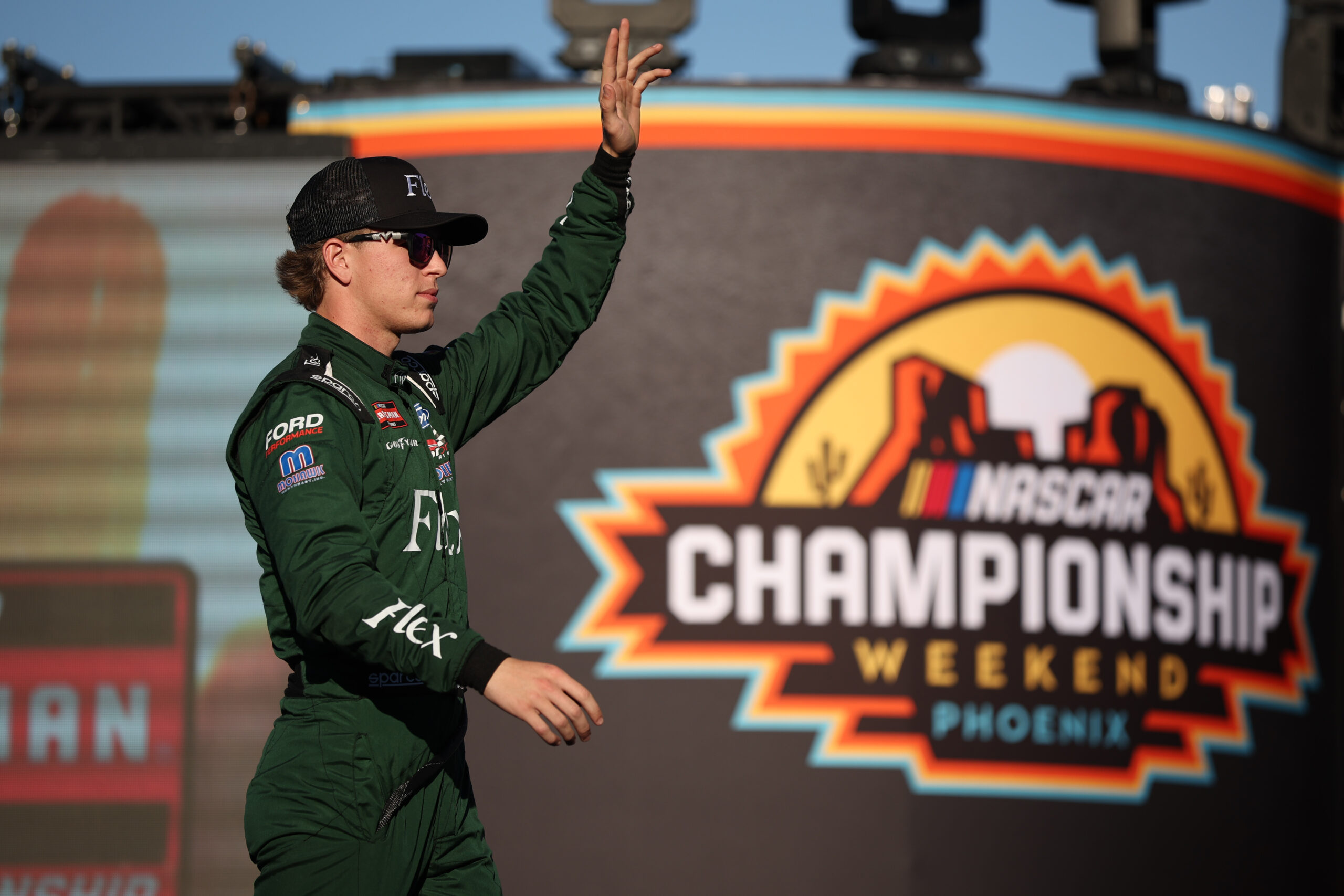 AVONDALE, ARIZONA - OCTOBER 31: Luke Baldwin, driver of the #66 Flex Ford, waves to fans as he walks onstage during driver intros prior to the NASCAR Craftsman Truck Series Championship at Phoenix Raceway on October 31, 2025 in Avondale, Arizona. (Photo by James Gilbert/Getty Images)