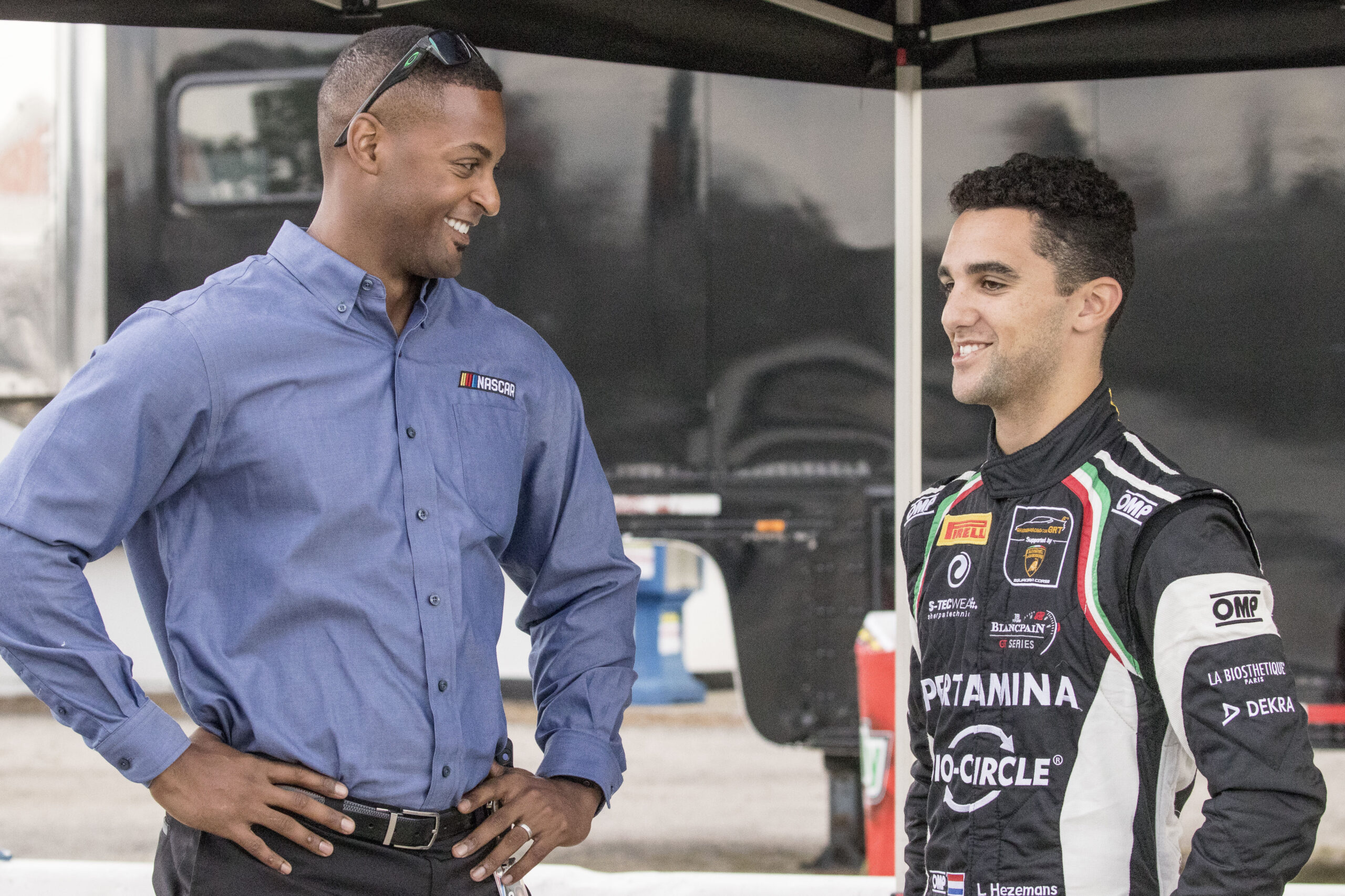 NEW SMYRNA BEACH, FL - OCTOBER 23: Jusan Hamilton, L, talks with Loris Hezemans, of the Netherlands, NASCAR Drive for Diversity Combine at New Smyrna Speedway on October 23, 2018 in New Smyrna Beach, Florida.