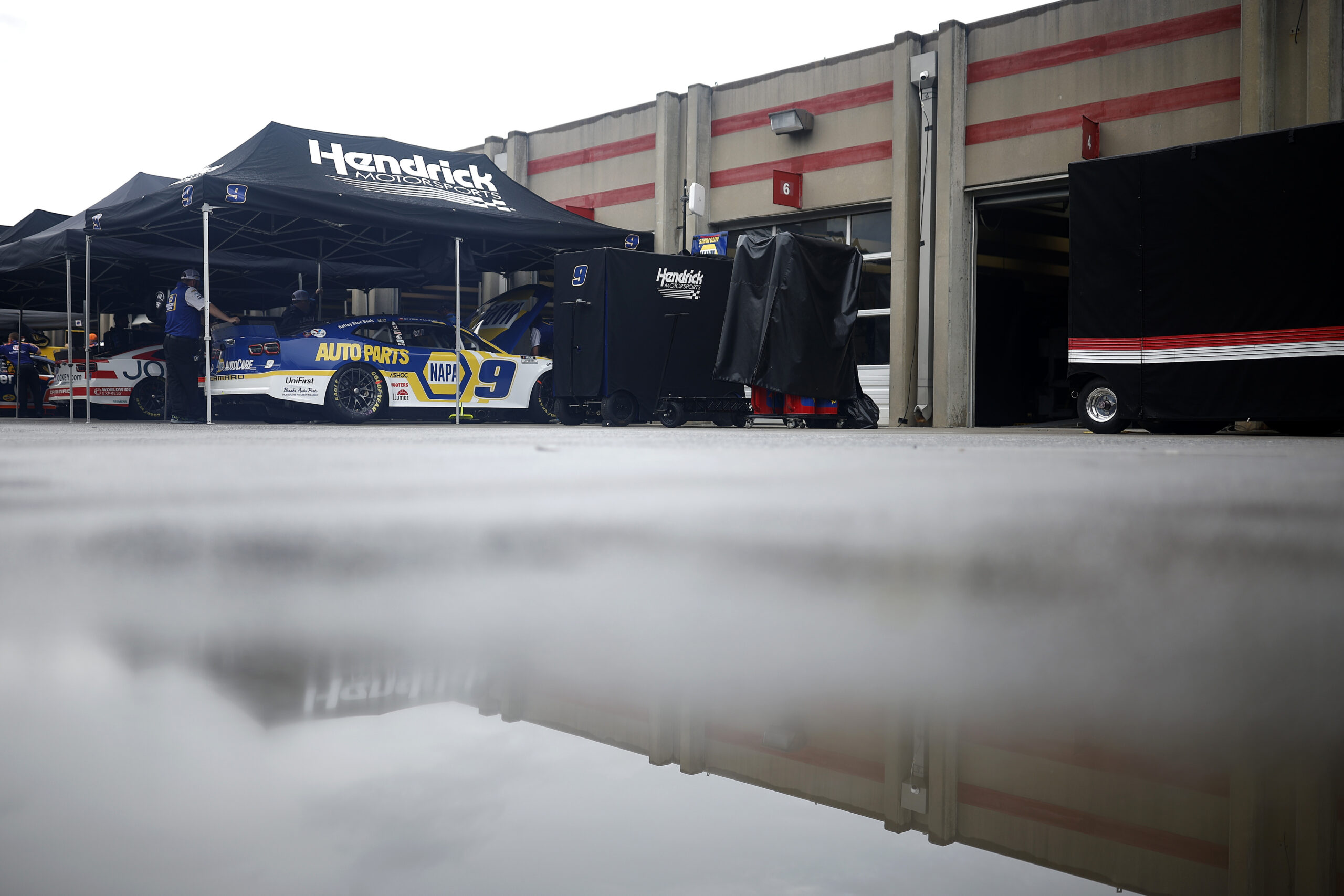 HAMPTON, GEORGIA - JULY 09: A general view of the garage area during a rain delay to qualifying for the NASCAR Xfinity Series Alsco Uniforms 250 at Atlanta Motor Speedway on July 09, 2022 in Hampton, Georgia. (Photo by Jared C. Tilton/Getty Images)
