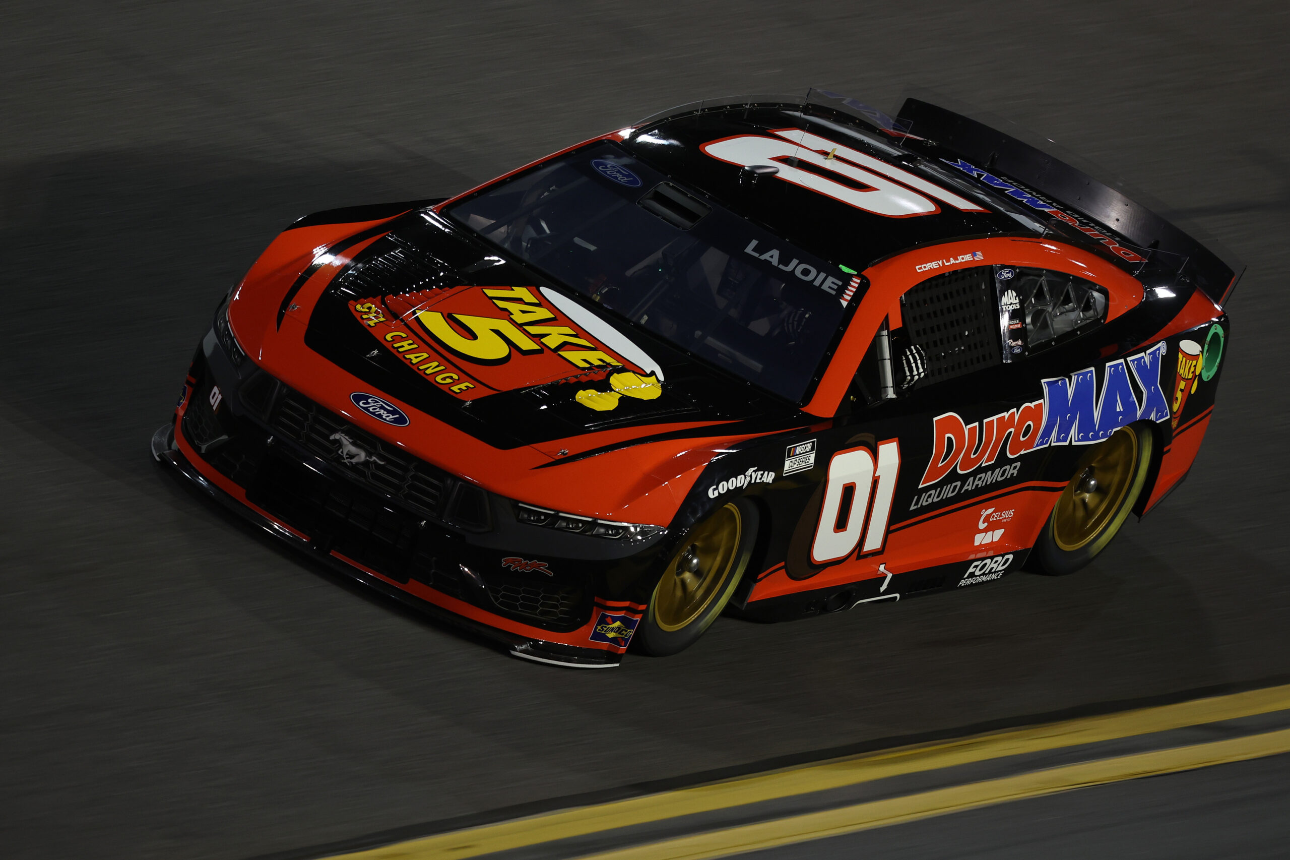 DAYTONA BEACH, FLORIDA - FEBRUARY 12: Corey LaJoie, driver of the #01 Take 5 Oil Change/DuraMax Ford drives during qualifying for the NASCAR Cup Series Daytona 500 at Daytona International Speedway on February 12, 2025 in Daytona Beach, Florida. (Photo by James Gilbert/Getty Images)