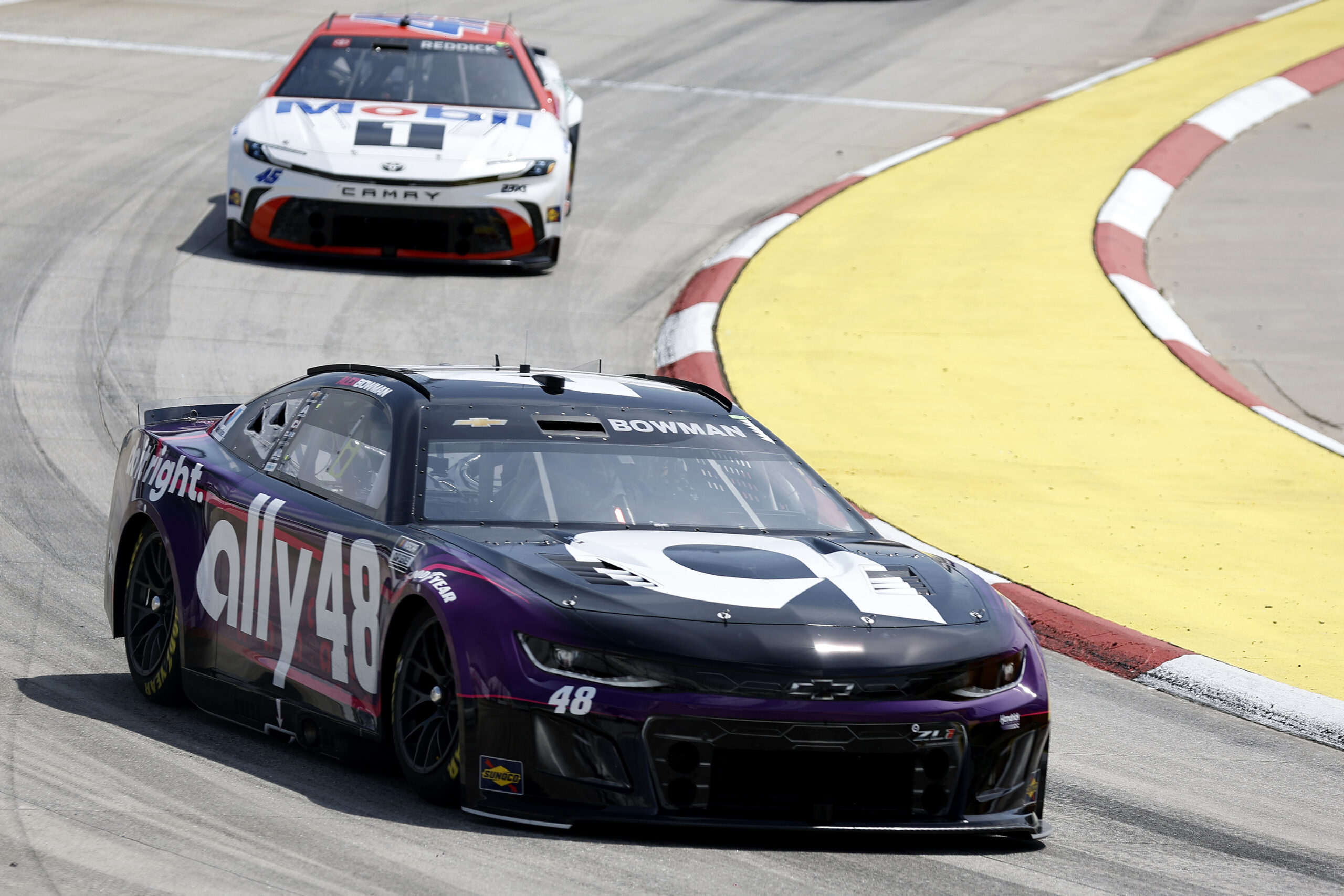MARTINSVILLE, VIRGINIA - MARCH 29: Alex Bowman, driver of the #48 Ally Chevrolet, and Tyler Reddick, driver of the #45 Mobil 1/O'Reilly Auto Parts Toyota, drive during practice for the NASCAR Cup Series Cook Out 400 at Martinsville Speedway on March 29, 2025 in Martinsville, Virginia. (Photo by Logan Riely/Getty Images)