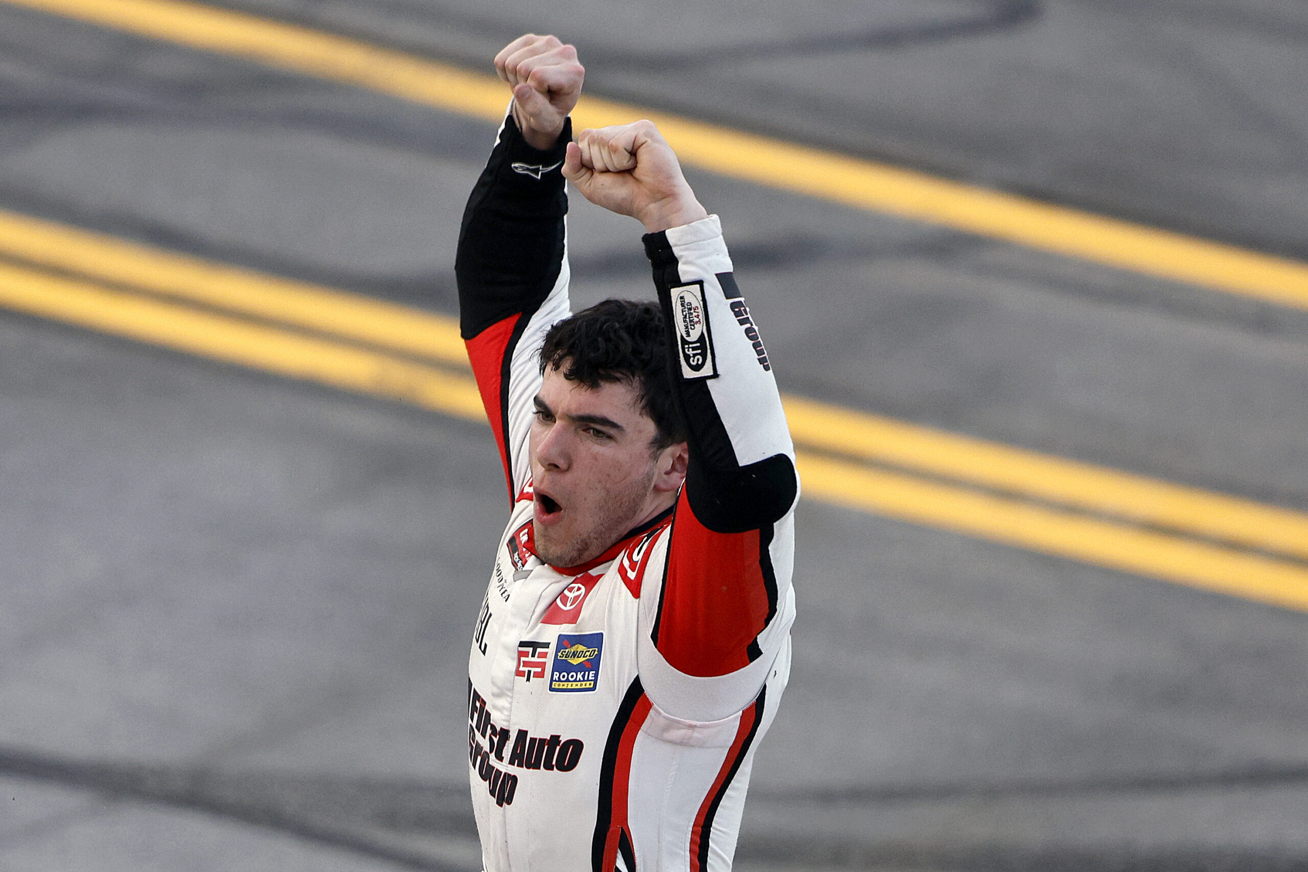 TALLADEGA, ALABAMA - OCTOBER 17: Giovanni Ruggiero, driver of the #17 First Auto Group Toyota, celebrates after winning the NASCAR Craftsman Truck Series Love's RV Stop 225 at Talladega Superspeedway on October 17, 2025 in Talladega, Alabama. (Photo by Sean Gardner/Getty Images)