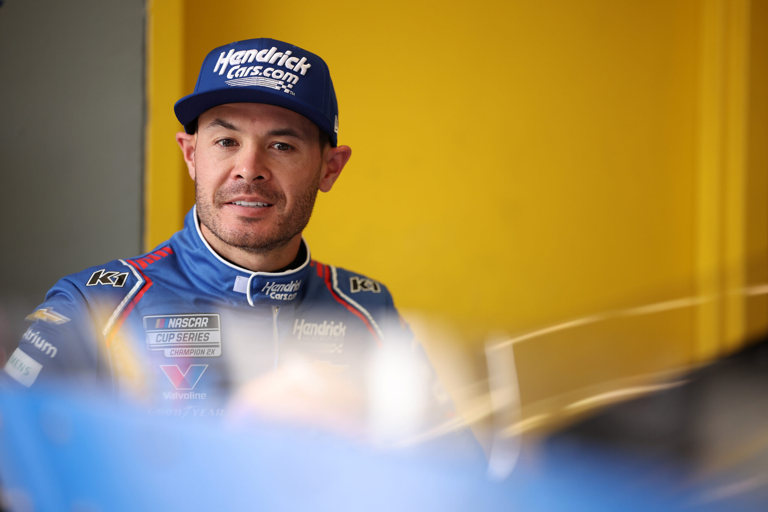DAYTONA BEACH, FLORIDA - FEBRUARY 11: Kyle Larson, driver of the #5 HendrickCars.com Chevrolet, looks on in the garage area during practice for the NASCAR Cup Series Daytona 500 at Daytona International Speedway on February 11, 2026 in Daytona Beach, Florida. (Photo by James Gilbert/Getty Images)