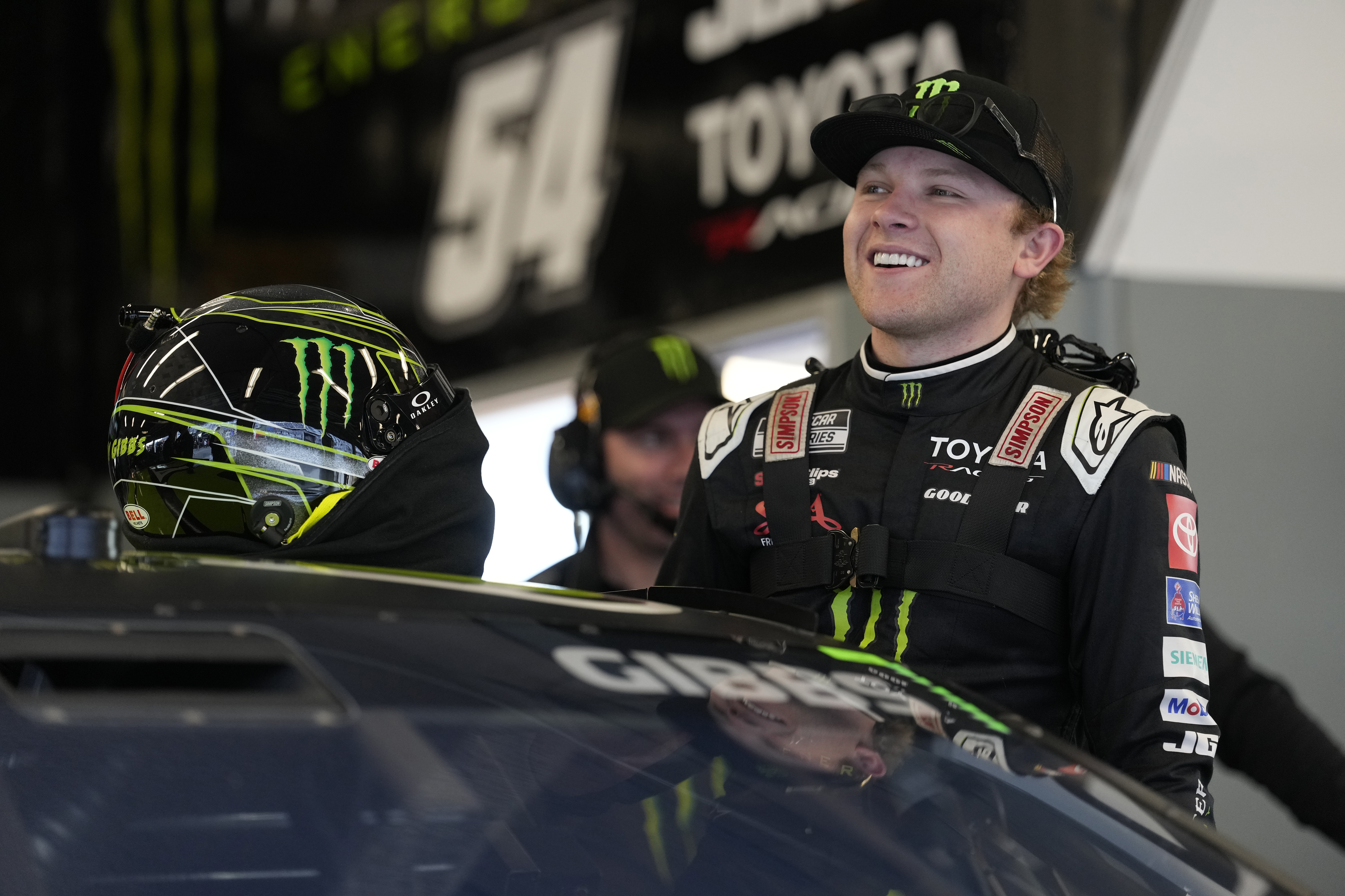 DAYTONA BEACH, FLORIDA - FEBRUARY 13: Ty Gibbs, driver of the #54 Monster Energy Toyota, enters his car in the garage area during practice for the NASCAR Cup Series Daytona 500 at Daytona International Speedway on February 13, 2026 in Daytona Beach, Florida.