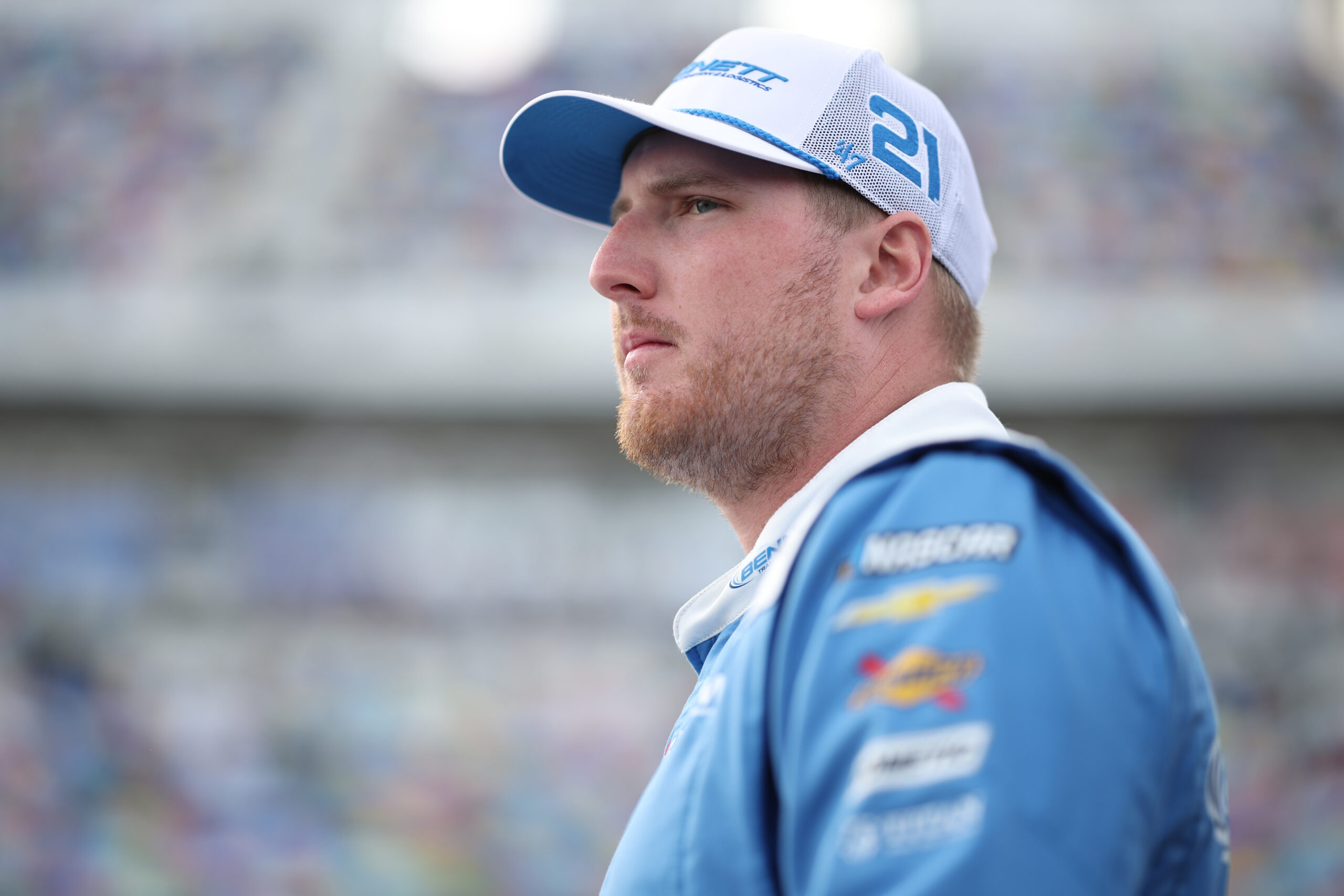 DAYTONA BEACH, FLORIDA - FEBRUARY 14: Austin Hill, driver of the #21 Bennett Transportation Chevrolet, waits on the grid prior to the NASCAR O'Reilly Auto Parts Series United Rentals 300 at Daytona International Speedway on February 14, 2026 in Daytona Beach, Florida. (Photo by James Gilbert/Getty Images)