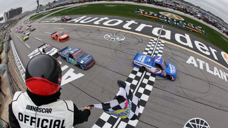 HAMPTON, GEORGIA - FEBRUARY 21: Kyle Busch, driver of the #7 HendrickCars.com Chevrolet, takes the checkered flag to win the NASCAR Craftsman Truck Series Fr8 Racing 208 at Echo Park Speedway on February 21, 2026 in Hampton, Georgia. (Photo by Jonathan Bachman/Getty Images)