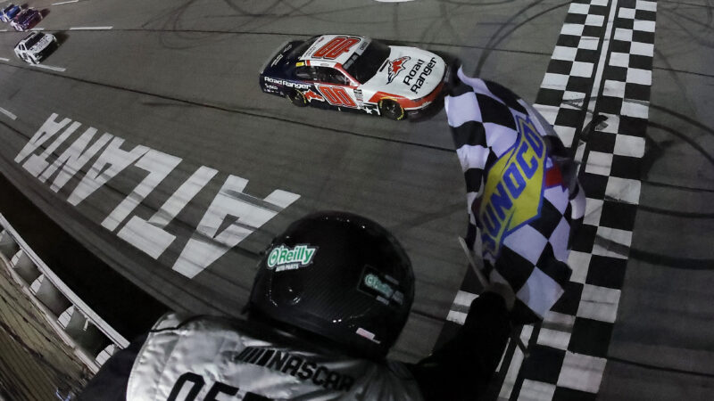 HAMPTON, GEORGIA - FEBRUARY 21: Sheldon Creed, driver of the #00 Road Ranger Chevrolet, takes the checkered flag to win the NASCAR O'Reilly Auto Parts Series Bennett Transportation & Logistics 250 at Echo Park Speedway on February 21, 2026 in Hampton, Georgia.