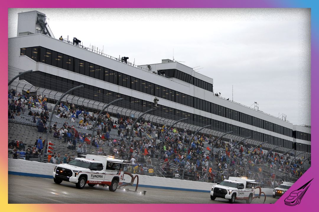 DOVER, DELAWARE - MAY 01: The NASCAR Track Drying Team works to dry the track during a rain delay in the NASCAR Cup Series DuraMAX Drydene 400 presented by RelaDyne at Dover Motor Speedway on May 01, 2022 in Dover, Delaware. (Photo by Sean Gardner/Getty Images)