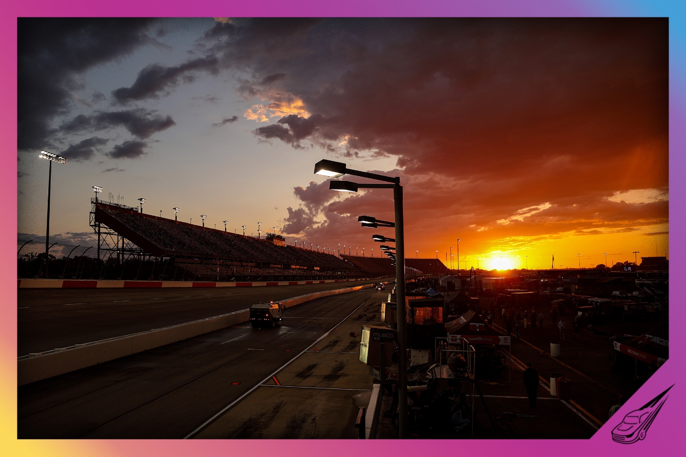 DARLINGTON, SOUTH CAROLINA - MAY 10: The NASCAR Track Drying Team works to dry the track as the sun sets during a weather delay prior to the NASCAR Craftsman Truck Series Buckle Up South Carolina 200 at Darlington Raceway on May 10, 2024 in Darlington, South Carolina. (Photo by James Gilbert/Getty Images)