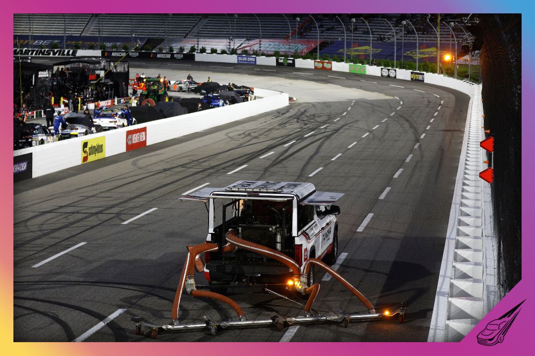 MARTINSVILLE, VIRGINIA - APRIL 08: The NASCAR Track Drying Team works to dry the track during a rain delay prior to the NASCAR Xfinity Series Call 811 Before You Dig 250 powered by Call 811.com at Martinsville Speedway on April 08, 2022 in Martinsville, Virginia. (Photo by Jared C. Tilton/Getty Images)