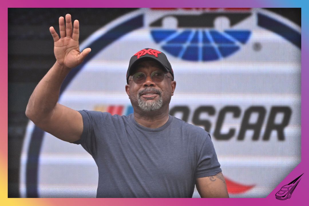 AUSTIN, TEXAS - MARCH 26: Musician Darius Rucker waves to fans as he walks onstage during pre-race ceremonies prior to the NASCAR Cup Series EchoPark Automotive Grand Prix at Circuit of The Americas on March 26, 2023 in Austin, Texas. (Photo by Logan Riely/Getty Images)