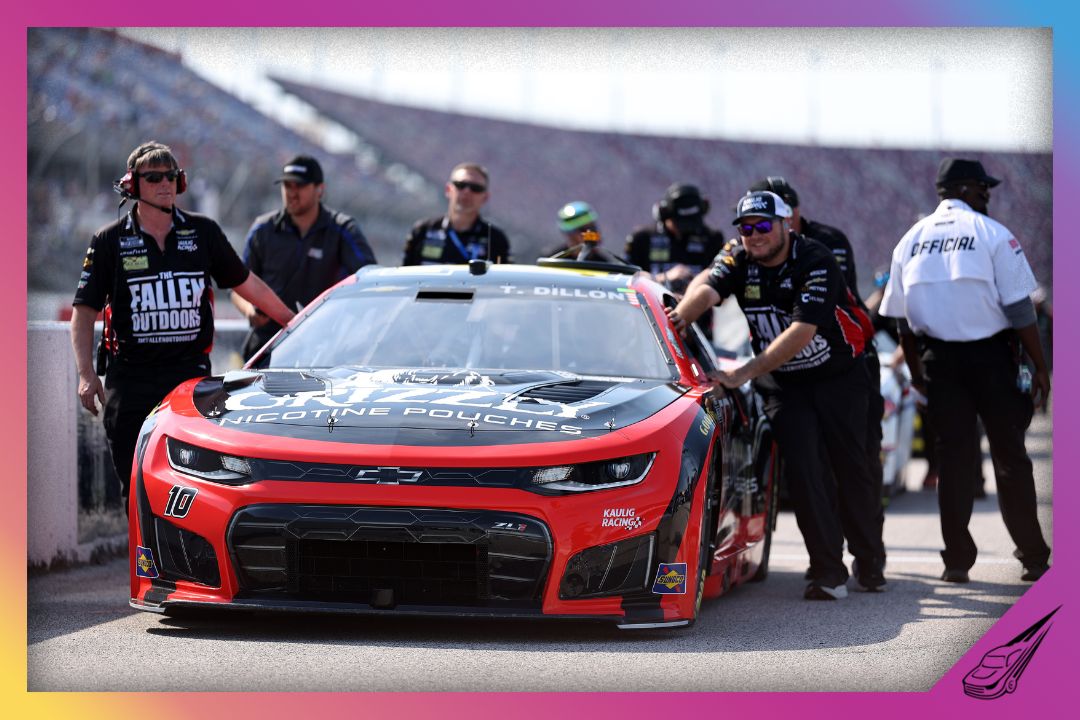 DARLINGTON, SOUTH CAROLINA - MARCH 21: Crew members push the #10 Grizzly Nicotine Pouches Chevrolet, driven by Ty Dillon on the grid during qualifying for the NASCAR Cup Series Goodyear 400 at Darlington Raceway on March 21, 2026 in Darlington, South Carolina. (Photo by David Jensen/Getty Images)