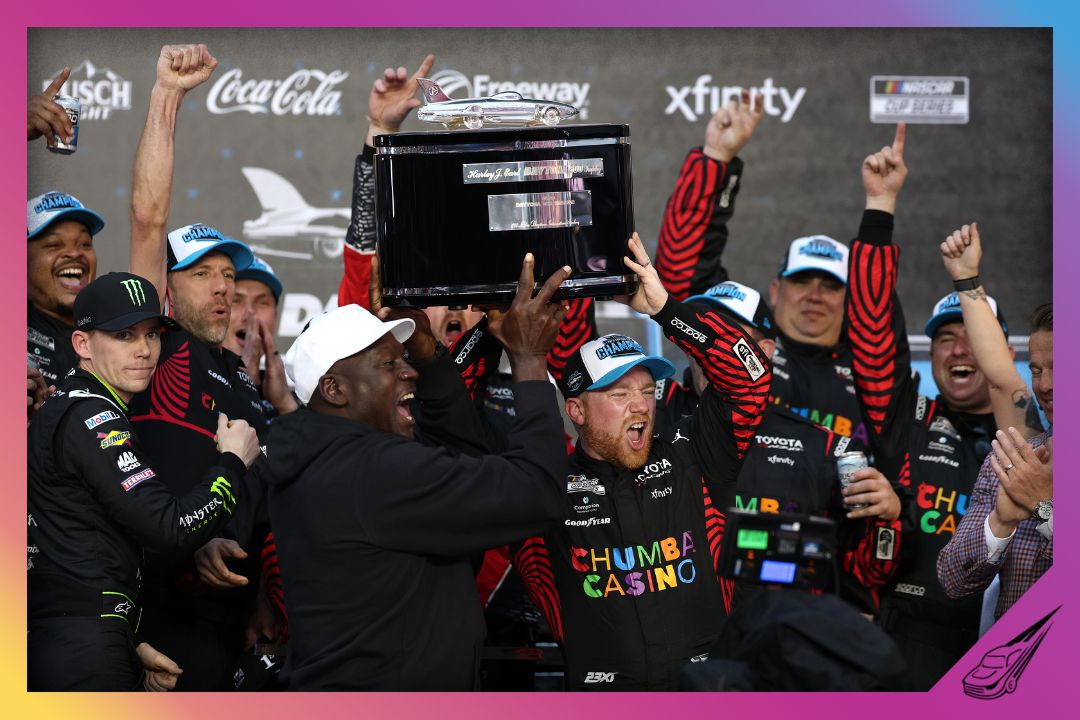 DAYTONA BEACH, FLORIDA - FEBRUARY 15: Tyler Reddick, driver of the #45 Chumba Casino Toyota, and Michael Jordan, NBA Hall of Famer and co-owner of 23XI Racing lift the Harley J. Earl Trophy in victory lane after winning the NASCAR Cup Series Daytona 500 at Daytona International Speedway on February 15, 2026 in Daytona Beach, Florida. (Photo by Chris Graythen/Getty Images)