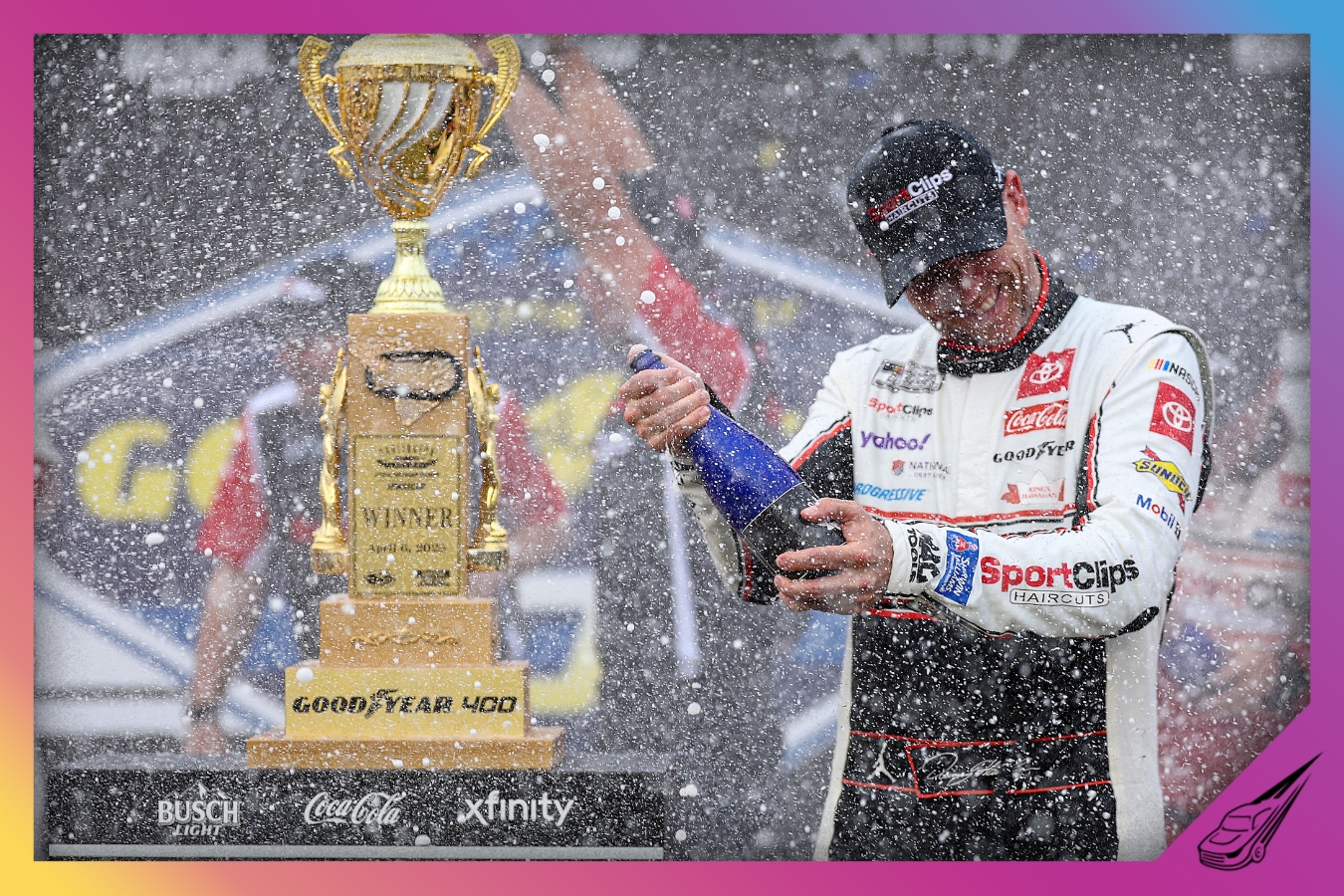 DARLINGTON, SOUTH CAROLINA - APRIL 06: Denny Hamlin, driver of the #11 Sport Clips Haircuts Toyota, celebrates by spraying champagne in victory lane after winning the NASCAR Cup Series Goodyear 400 at Darlington Raceway on April 06, 2025 in Darlington, South Carolina. (Photo by Jared C. Tilton/Getty Images)