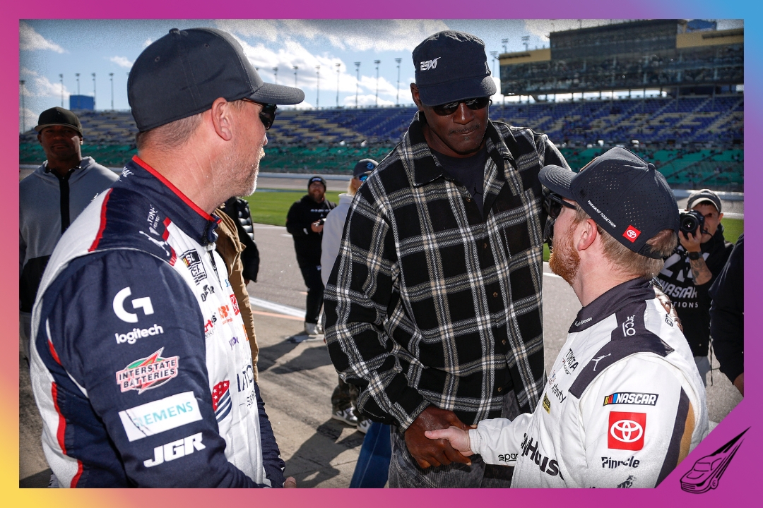 KANSAS CITY, KANSAS - APRIL 18: Michael Jordan, NBA Hall of Famer and Denny Hamlin, driver of the #11 National Debt Relief Toyota, (L) co-owners of 23XI Racing congratulates Tyler Reddick, driver of the #45 Supply House Toyota, (R) after winning the pole award during practice for the NASCAR Cup Series AdventHealth 400 at Kansas Speedway on April 18, 2026 in Kansas City, Kansas. (Photo by Sean Gardner/Getty Images)