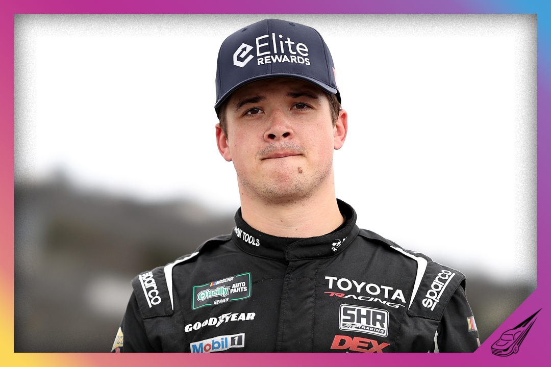 ROCKINGHAM, NORTH CAROLINA - APRIL 03: Harrison Burton, driver of the #24 Elite Rewards Toyota, walks the grid during the NASCAR Craftsman Truck Series Black's Tire 200 at Rockingham Speedway on April 03, 2026 in Rockingham, North Carolina. (Photo by Meg Oliphant/Getty Images)