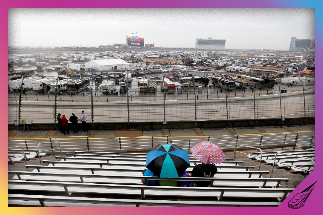 FORT WORTH, TX - APRIL 06: Fans wait in the stands as rain falls prior to the NASCAR Sprint Cup Series Duck Commander 500 at Texas Motor Speedway on April 6, 2014 in Fort Worth, Texas. (Photo by Sarah Glenn/Getty Images for Texas Motor Speedway)