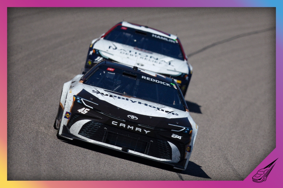 KANSAS CITY, KANSAS - APRIL 19: Tyler Reddick, driver of the #45 Supply House Toyota, and Denny Hamlin, driver of the #11 National Debt Relief Toyota, race during the NASCAR Cup Series AdventHealth 400 at Kansas Speedway on April 19, 2026 in Kansas City, Kansas. (Photo by Sean Gardner/Getty Images)
