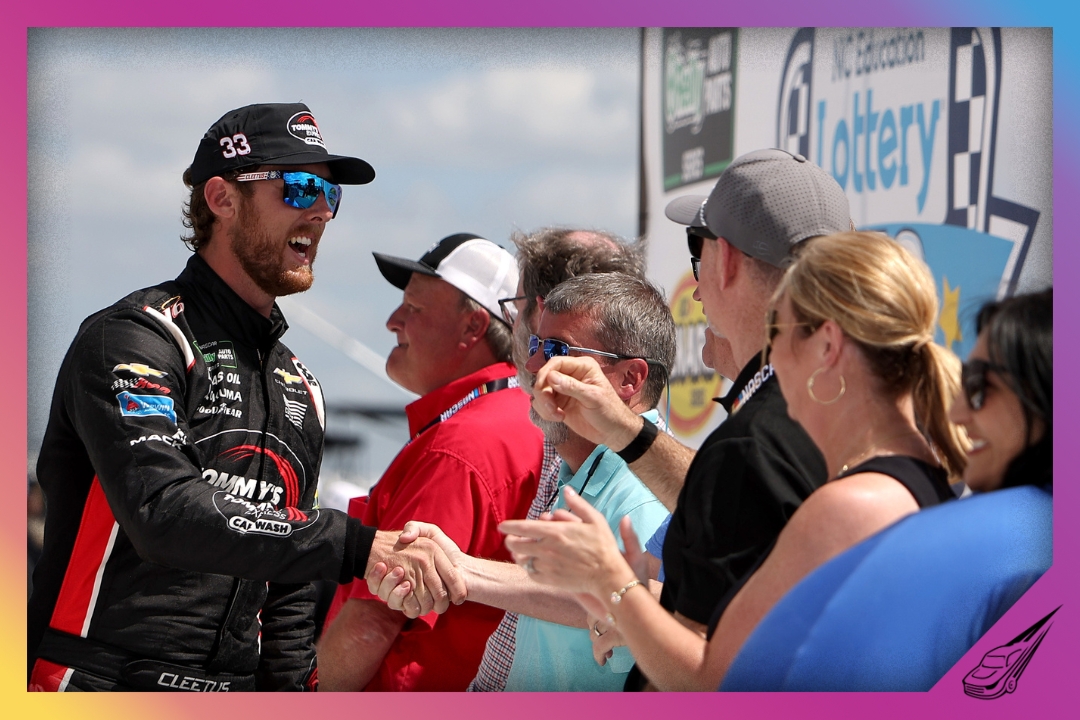 ROCKINGHAM, NORTH CAROLINA - APRIL 04: Cleetus McFarland, driver of the #33 Tommy's Express Car wash Chevrolet, shakes hands with guest as he walks onstage during pre-race ceremonies prior to the NASCAR O'Reilly Auto Parts Series North Carolina Education Lottery 250 Presented by Black's Tire at Rockingham Speedway on April 04, 2026 in Rockingham, North Carolina. (Photo by Meg Oliphant/Getty Images)