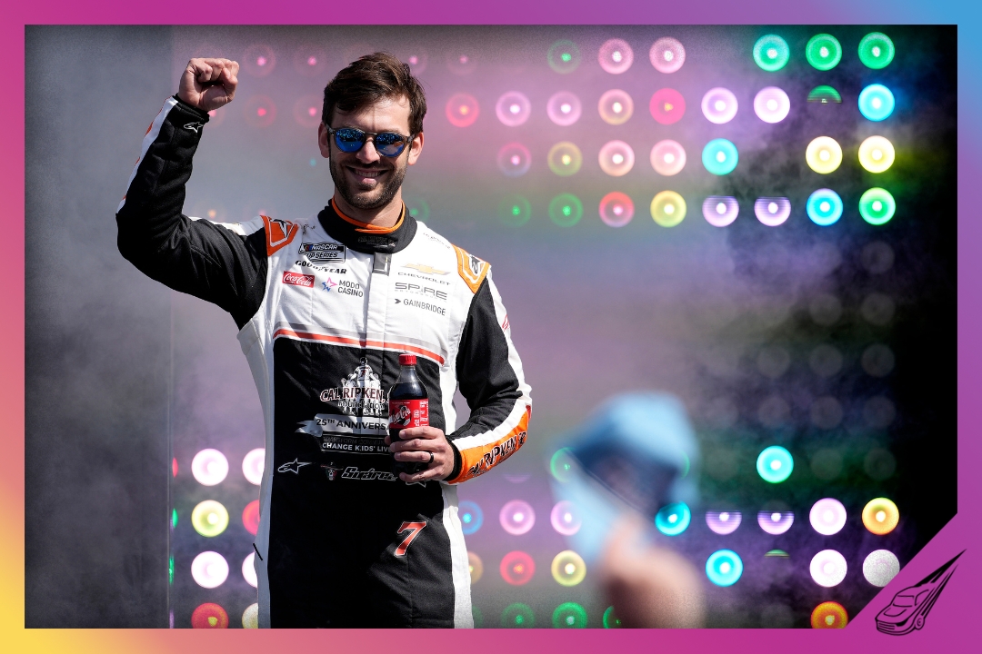 MARTINSVILLE, VIRGINIA - MARCH 29: Daniel Suarez, driver of the #7 Group 1001 Chevrolet, waves to fans as he walks onstage during driver intros prior to the NASCAR Cup Series Cook Out 400 at Martinsville Speedway on March 29, 2026 in Martinsville, Virginia. (Photo by Jacob Kupferman/Getty Images)