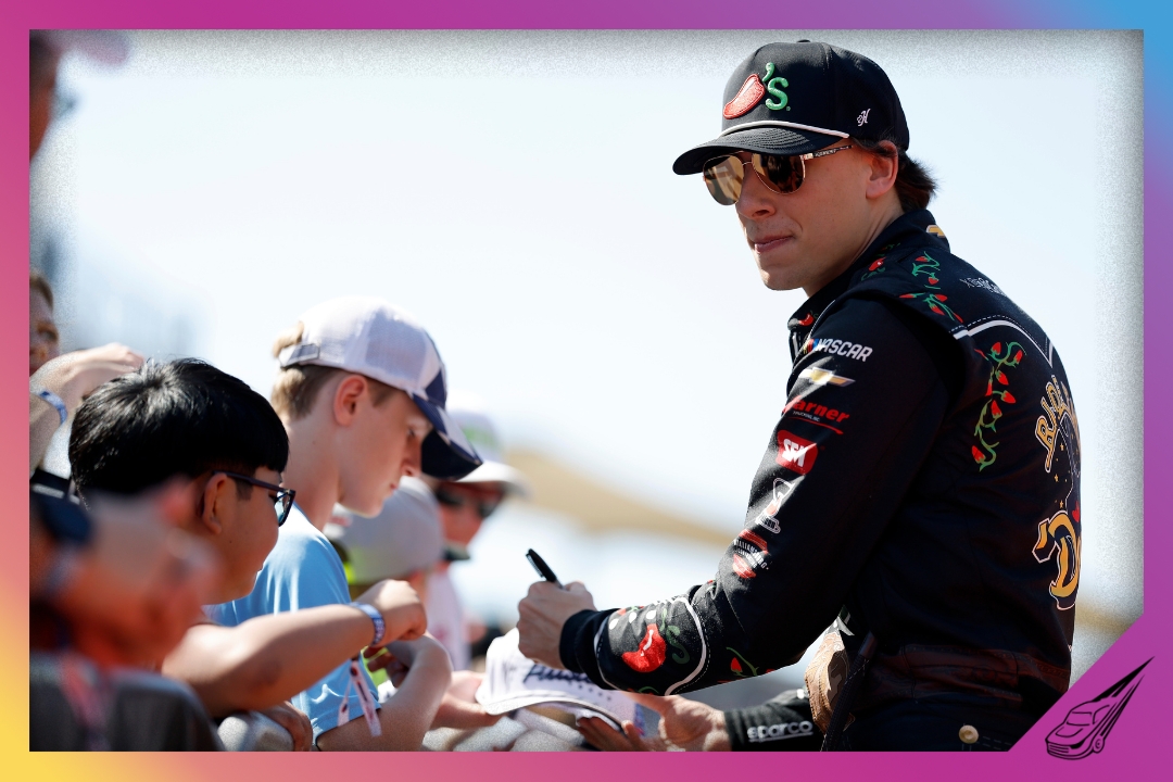 AUSTIN, TEXAS - MARCH 01: Carson Hocevar, driver of the #77 Chili's Ride the 'Dente Chevrolet, signs autographs for NASCAR fans on the red carpet prior to the NASCAR Cup Series DuraMax Grand Prix Powered by RelaDyne at Circuit of The Americas on March 01, 2026 in Austin, Texas. (Photo by Logan Riely/Getty Images)