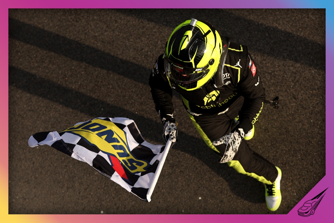 ROCKINGHAM, NORTH CAROLINA - APRIL 03: Corey Heim, driver of the #1 Robinhood Toyota, celebrates with the checkered flag after winning the NASCAR Craftsman Truck Series Black's Tire 200 at Rockingham Speedway on April 03, 2026 in Rockingham, North Carolina. (Photo by Meg Oliphant/Getty Images)