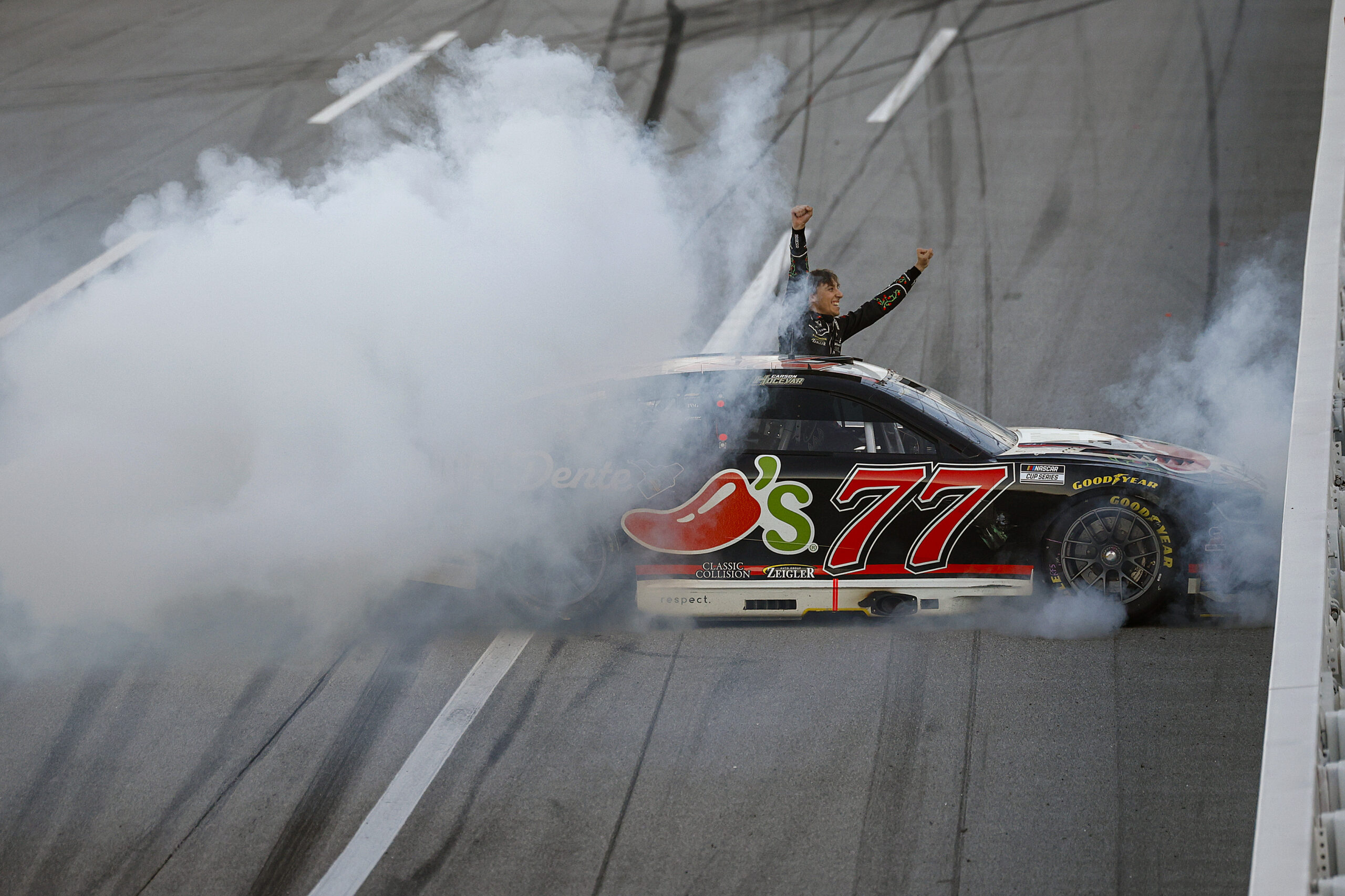 TALLADEGA, ALABAMA - APRIL 26: Carson Hocevar, driver of the #77 Chili's Ride the 'Dente Chevrolet, celebrates after winning the NASCAR Cup Series Jack Link's 500 at Talladega Superspeedway on April 26, 2026 in Talladega, Alabama. (Photo by Sean Gardner/Getty Images)