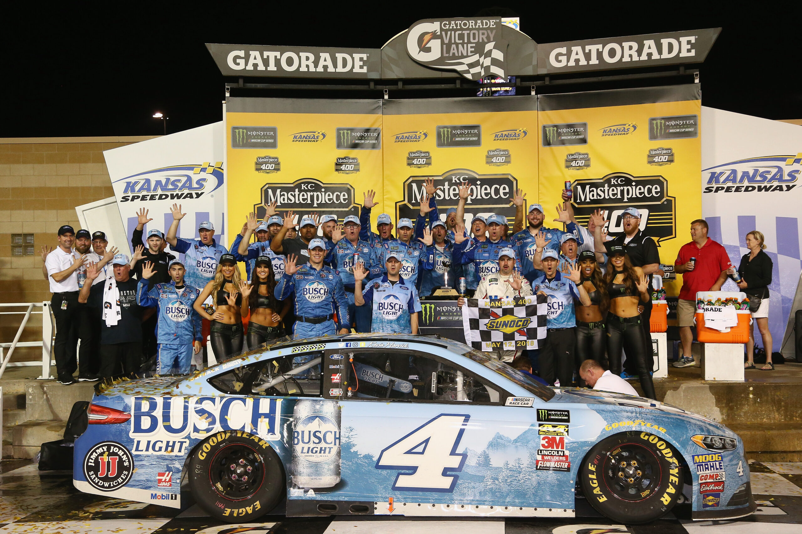 KANSAS CITY, KS - MAY 12: Kevin Harvick, driver of the #4 Busch Light Ford, and his team celebrate in victory lane after winning the Monster Energy NASCAR Cup Series KC Masterpiece 400 at Kansas Speedway on May 12, 2018 in Kansas City, Kansas. (Photo by Sarah Crabill/Getty Images)