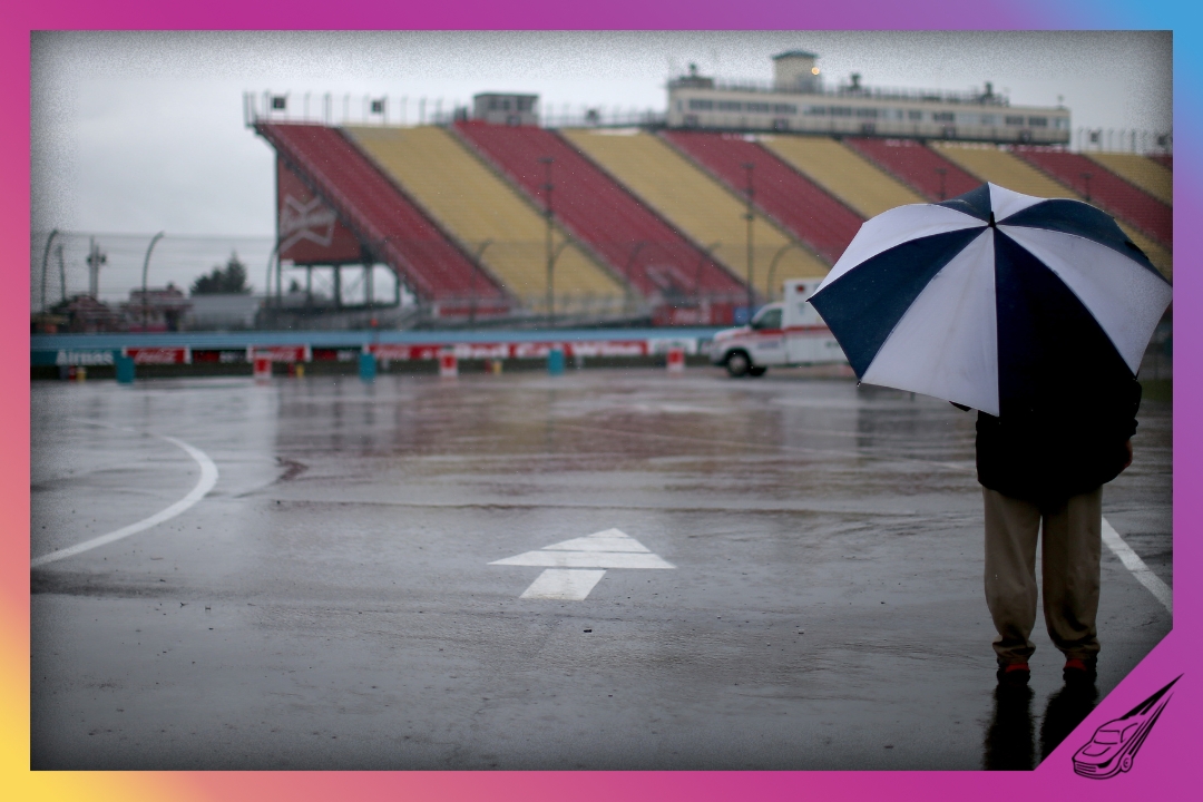 WATKINS GLEN, NY - AUGUST 09: A crewmember stands in the garagea area duing a rain delay for practice for the NASCAR Sprint Cup Series Cheez-It 355 at Watkins Glen International on August 9, 2013 in Watkins Glen, New York. (Photo by Mark Wilson/Getty Images)