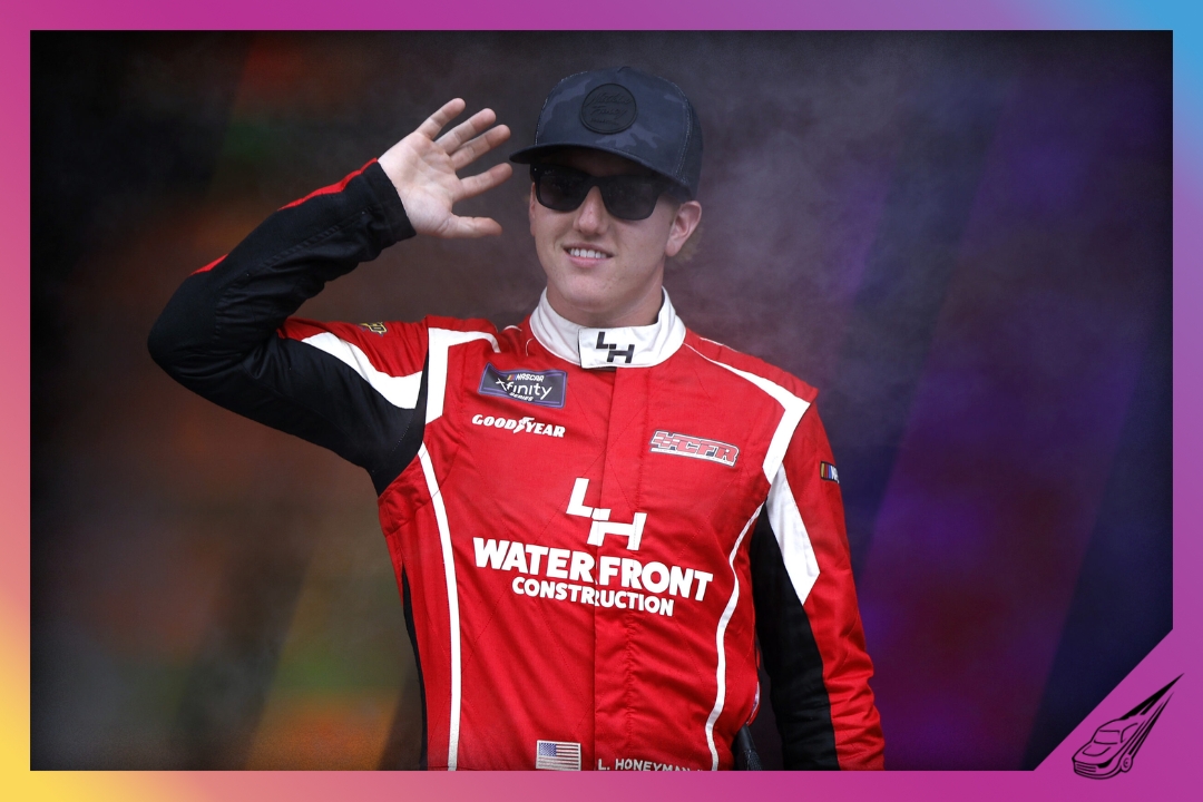 TALLADEGA, ALABAMA - OCTOBER 18: Leland Honeyman, driver of the #70 Wawa Chevrolet, waves to fans as he walks onstage during driver intros prior to the NASCAR Xfinity Series United Rentals 250 at Talladega Superspeedway on October 18, 2025 in Talladega, Alabama. (Photo by Sean Gardner/Getty Images)