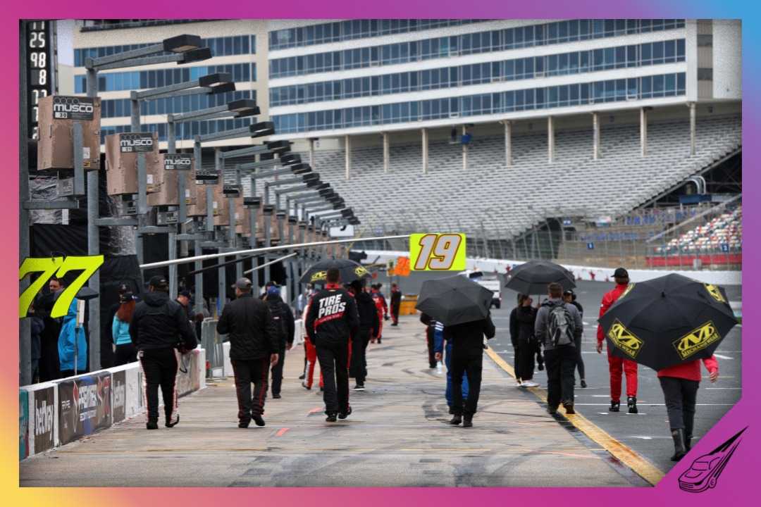CONCORD, NORTH CAROLINA - MAY 27: NASCAR pit crew members leave the pit area under a weather delay of the NASCAR Xfinity Series Alsco Uniforms 300 at Charlotte Motor Speedway on May 27, 2023 in Concord, North Carolina. (Photo by David Jensen/Getty Images)