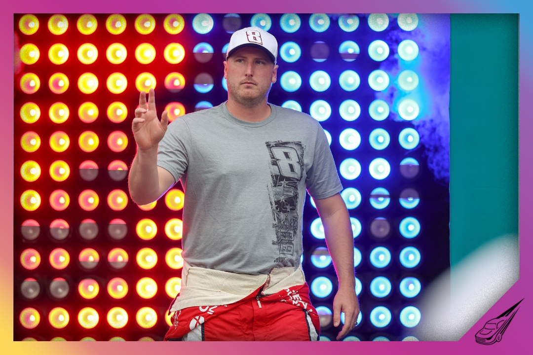 CONCORD, NORTH CAROLINA - MAY 23: Austin Hill, driver of the #21 Global Industrial Chevrolet, waves to fans as he walks onstage during driver intros prior to the NASCAR O'Reilly Auto Parts Series Charbroil 300 at Charlotte Motor Speedway on May 23, 2026 in Concord, North Carolina. (Photo by David Jensen/Getty Images)