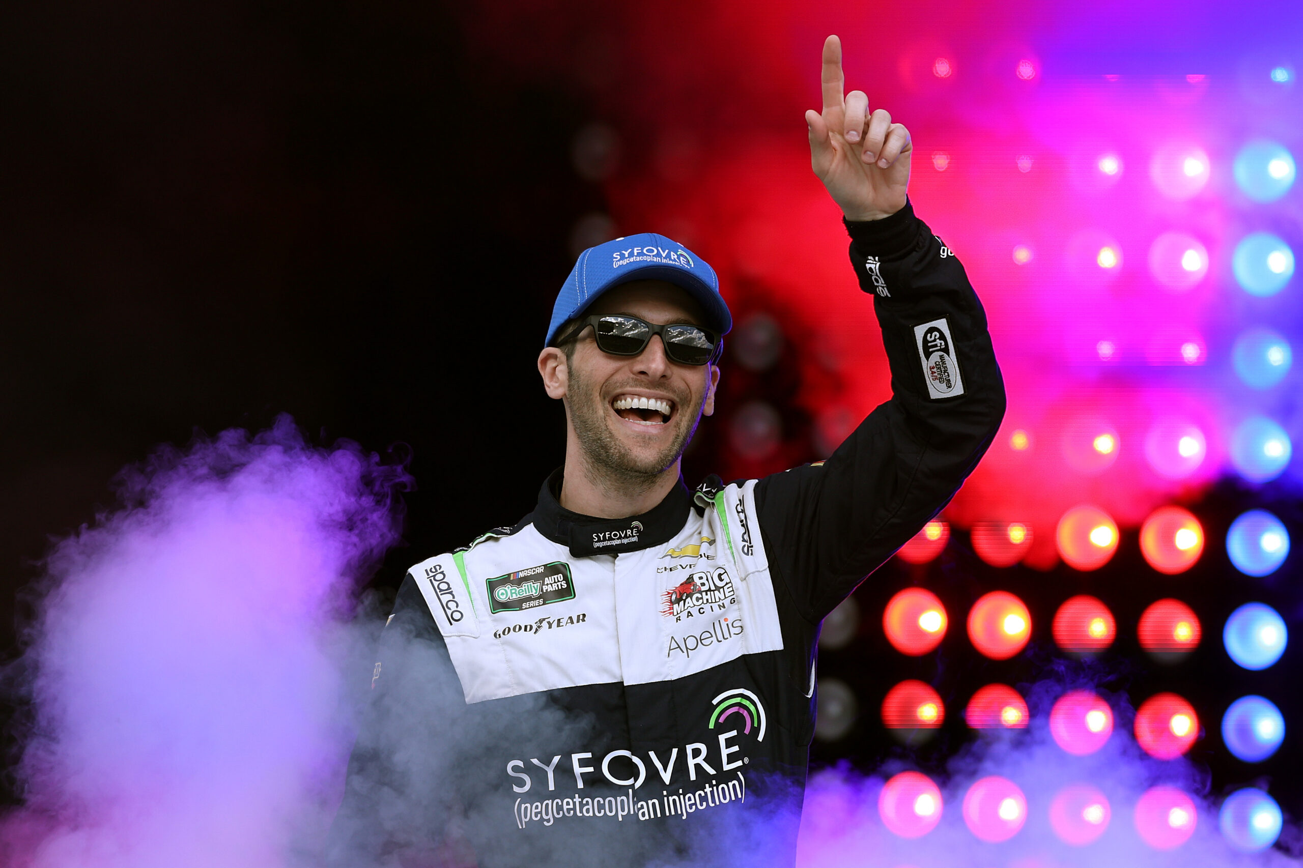 KANSAS CITY, KANSAS - APRIL 18: Patrick Staropoli, driver of the #48 Syfovre Chevrolet, waves to fans as he walks onstage during driver intros prior to the NASCAR O'Reilly Auto Parts Series Kansas Lottery 300 at Kansas Speedway on April 18, 2026 in Kansas City, Kansas.