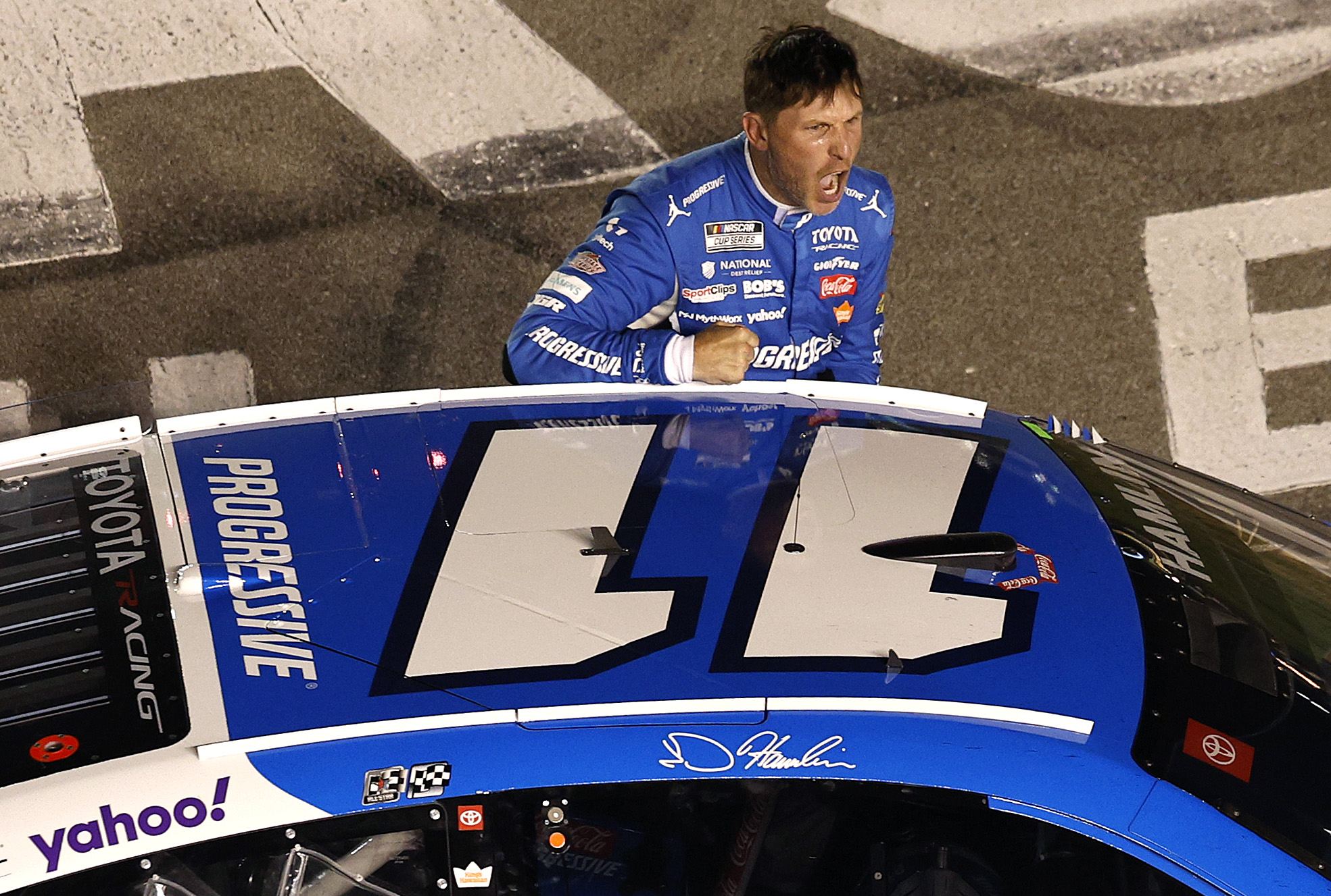 LEBANON, TENNESSEE - MAY 31: Denny Hamlin, driver of the #11 Progressive Insurance Toyota, reacts after winning the NASCAR Cup Series Cracker Barrel 400 at Nashville Superspeedway on May 31, 2026 in Lebanon, Tennessee. (Photo by Sean Gardner/Getty Images)