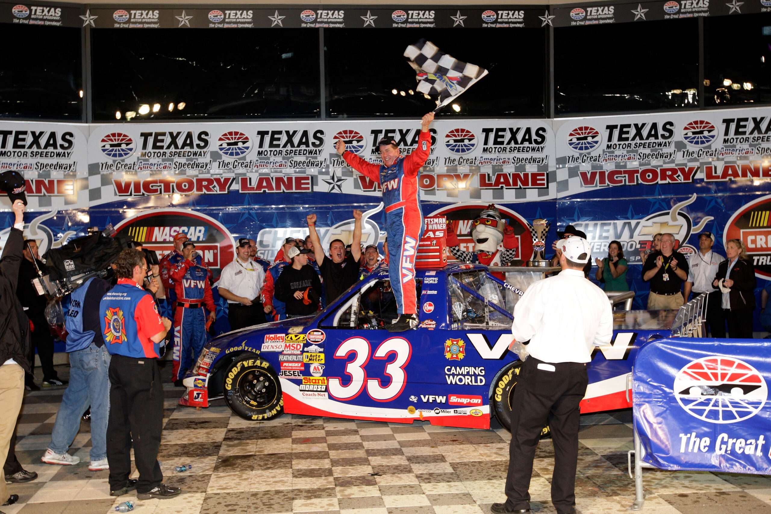 FORT WORTH, TX - OCTOBER 31: Ron Hornaday Jr., driver of the #33 VFW Chevrolet, celebrates in victory lane after winning the NASCAR Craftsman Truck Series Chevy Silverado 350K at Texas Motor Speedway on October 31, 2008 in Fort Worth, Texas. (Photo by John Harrelson/Getty Images for NASCAR)