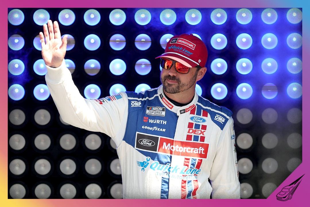 BROOKLYN, MICHIGAN - JUNE 07: Josh Berry, driver of the #21 Motorcraft/Quick Lane Ford, waves to fans as he walks onstage during driver intros prior to the NASCAR Cup Series FireKeepers Casino 400 at Michigan International Speedway on June 07, 2026 in Brooklyn, Michigan. (Photo by Brett Farmer/Getty Images)