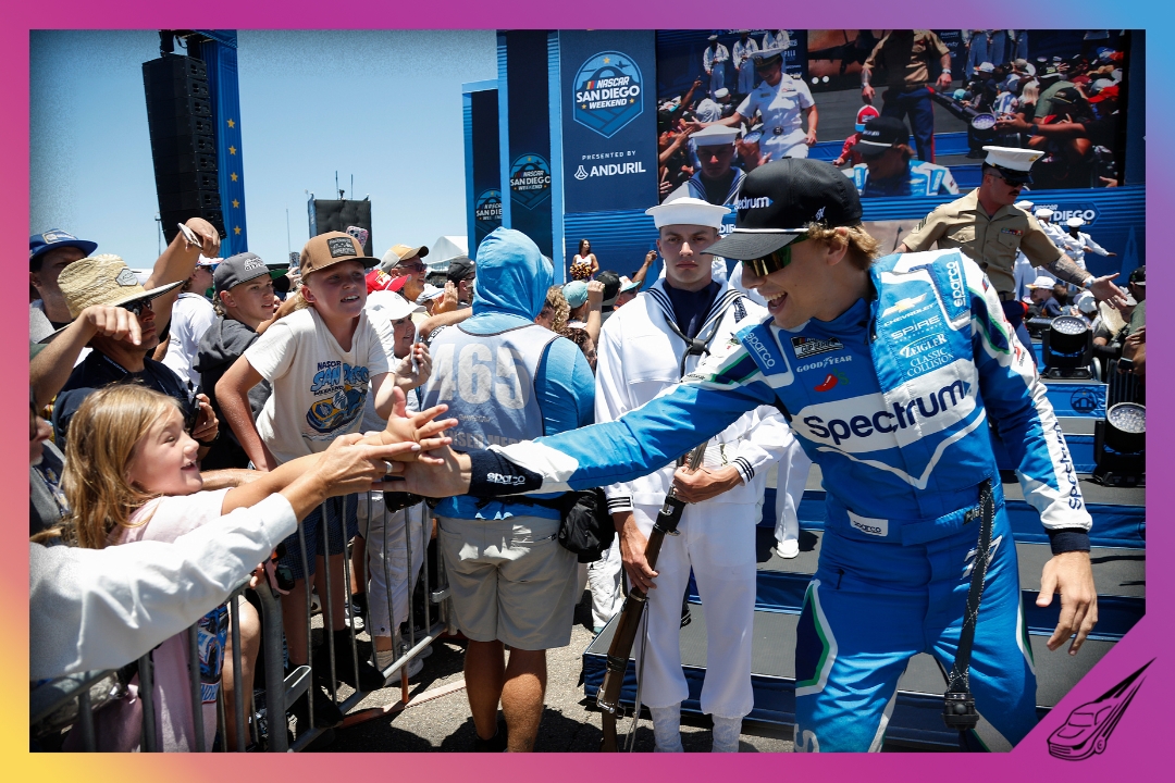 SAN DIEGO, CALIFORNIA - JUNE 21: Carson Hocevar, driver of the #77 Spectrum Chevrolet, greets fans during driver intros prior to the NASCAR Cup Series Anduril 250 at Naval Base Coronado on June 21, 2026 in San Diego, California. (Photo by Sean Gardner/Getty Images)