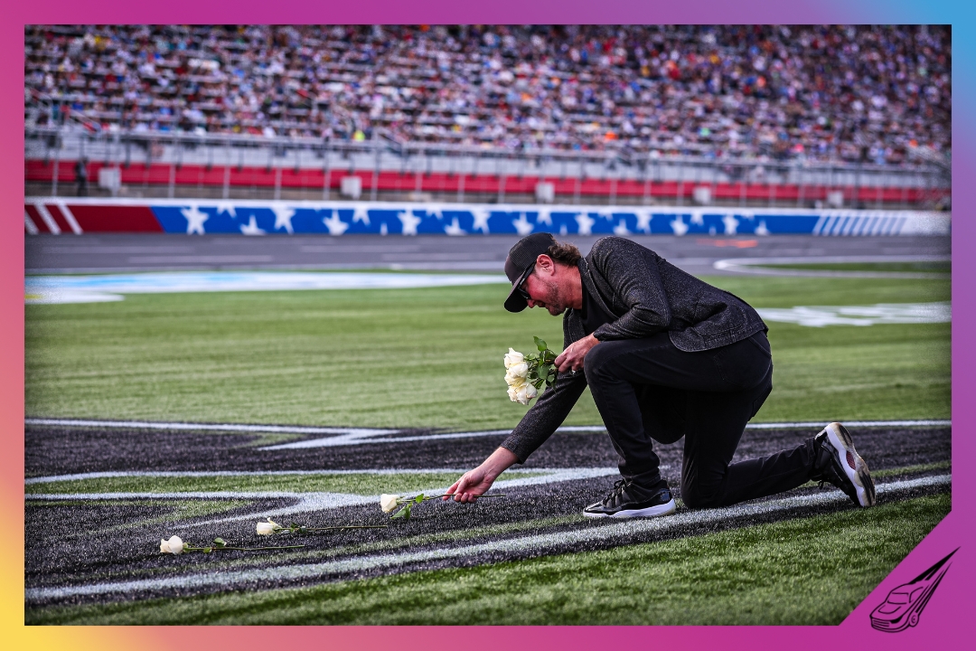 CONCORD, NORTH CAROLINA - MAY 24: NASCAR Hall of Famer Kurt Busch lays roses across a tribute to his late brother, Kyle Busch before the NASCAR Cup Series Coca-Cola 600 at Charlotte Motor Speedway on May 24, 2026 in Concord, North Carolina. (Photo by David Jensen/Getty Images)