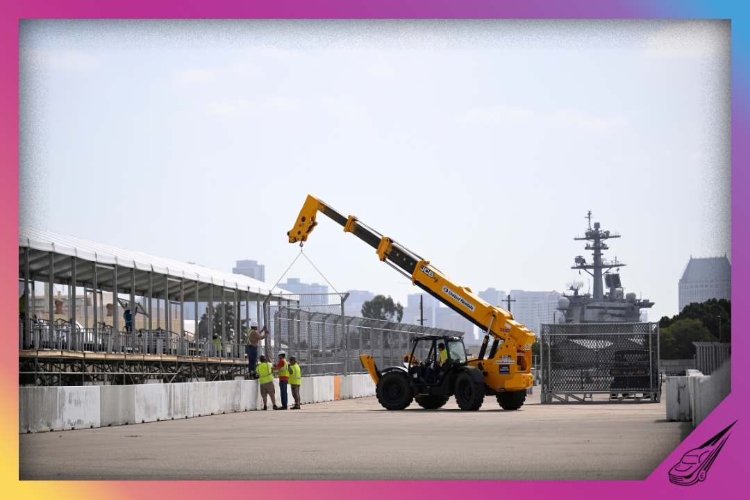 CORONADO, CALIFORNIA - JUNE 09: A general view of construction workers installing fencing to the top of concrete barriers for the NASCAR San Diego course at the Naval Base Coronado on June 09, 2026 in Coronado, California. (Photo by Orlando Ramirez/Getty Images)