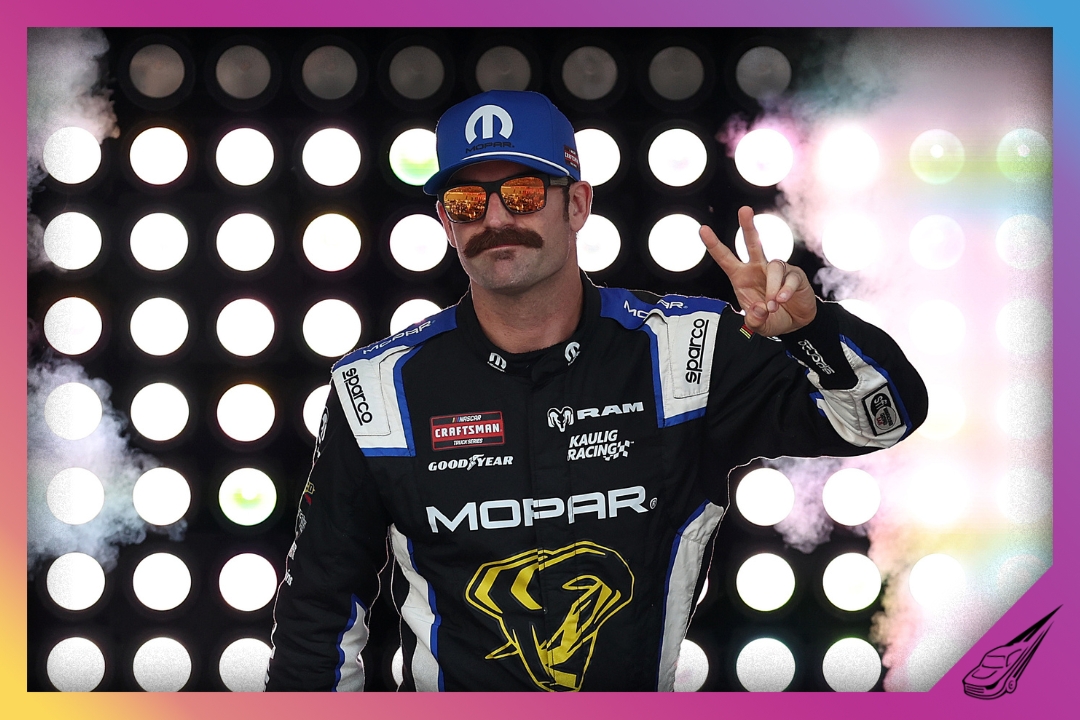 BROOKLYN, MICHIGAN - JUNE 06: Corey LaJoie, driver of the #10 Mopar RAM, waves to fans as he walks onstage during driver intros prior to the NASCAR Craftsman Truck Series DQS Solutions & Staffing 250 presented by Precision Vehicle Logistics at Michigan International Speedway on June 06, 2026 in Brooklyn, Michigan. (Photo by Brett Farmer/Getty Images)