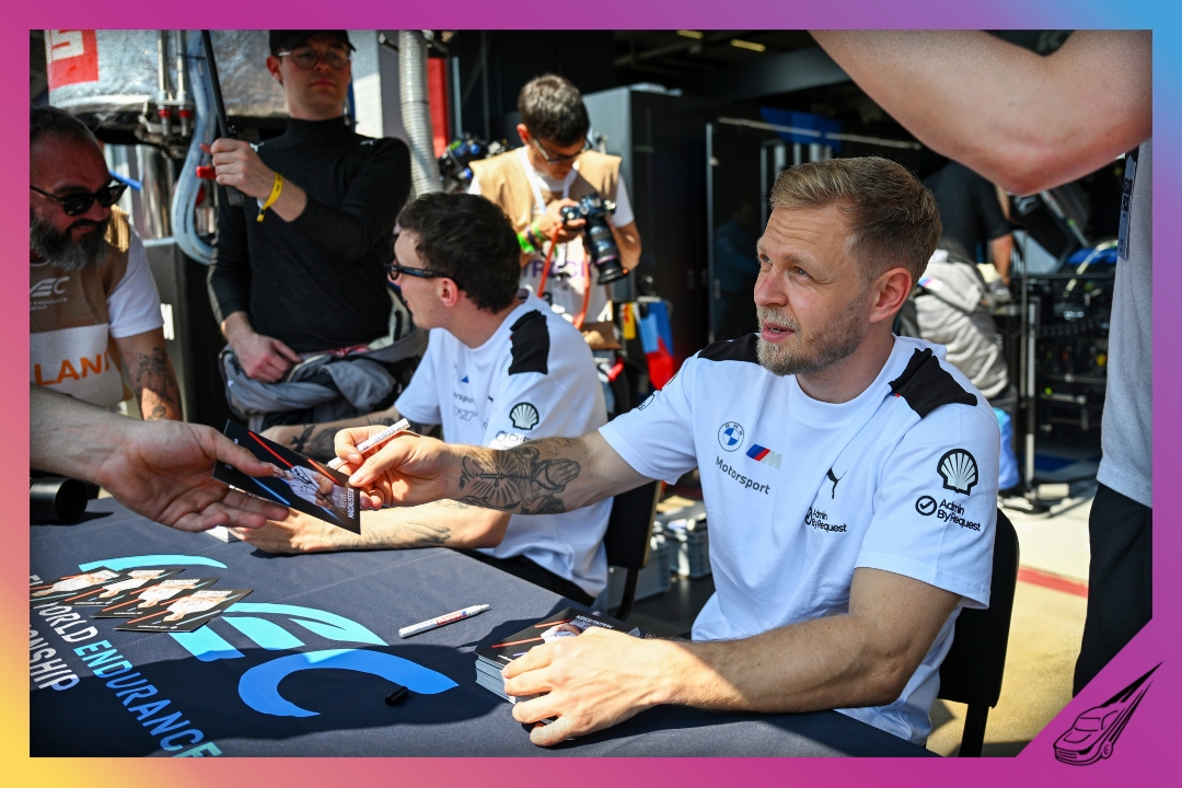 IMOLA, ITALY - APRIL 18: Kevin Magnussen of Denmark and BMW M Team WRT signs an autograph during the World Endurance Championship 6 Hours of Imola at Autodromo Enzo e Dino Ferrari on April 18, 2026 in Imola, Italy. (Photo by Rudy Carezzevoli/Getty Images)