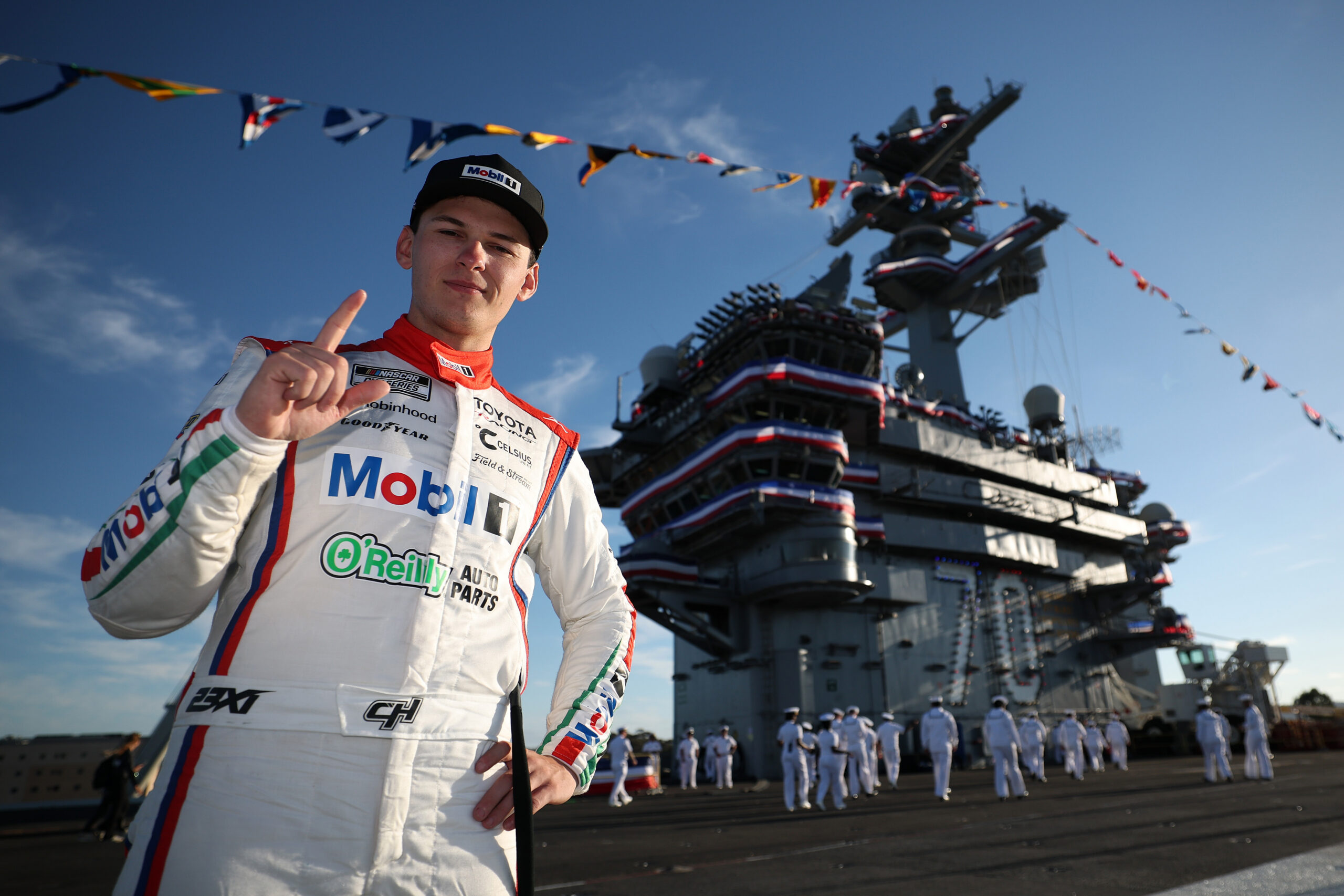 SAN DIEGO, CALIFORNIA - JUNE 21: Corey Heim, driver of the #67 Mobil 1/O'Reilly Auto Parts Toyota, poses for a photo on the deck of the The USS Carl Vinson (CVN-70) after winning the NASCAR Cup Series Anduril 250 at Naval Base Coronado on June 21, 2026 in San Diego, California. (Photo by Chris Graythen/Getty Images)