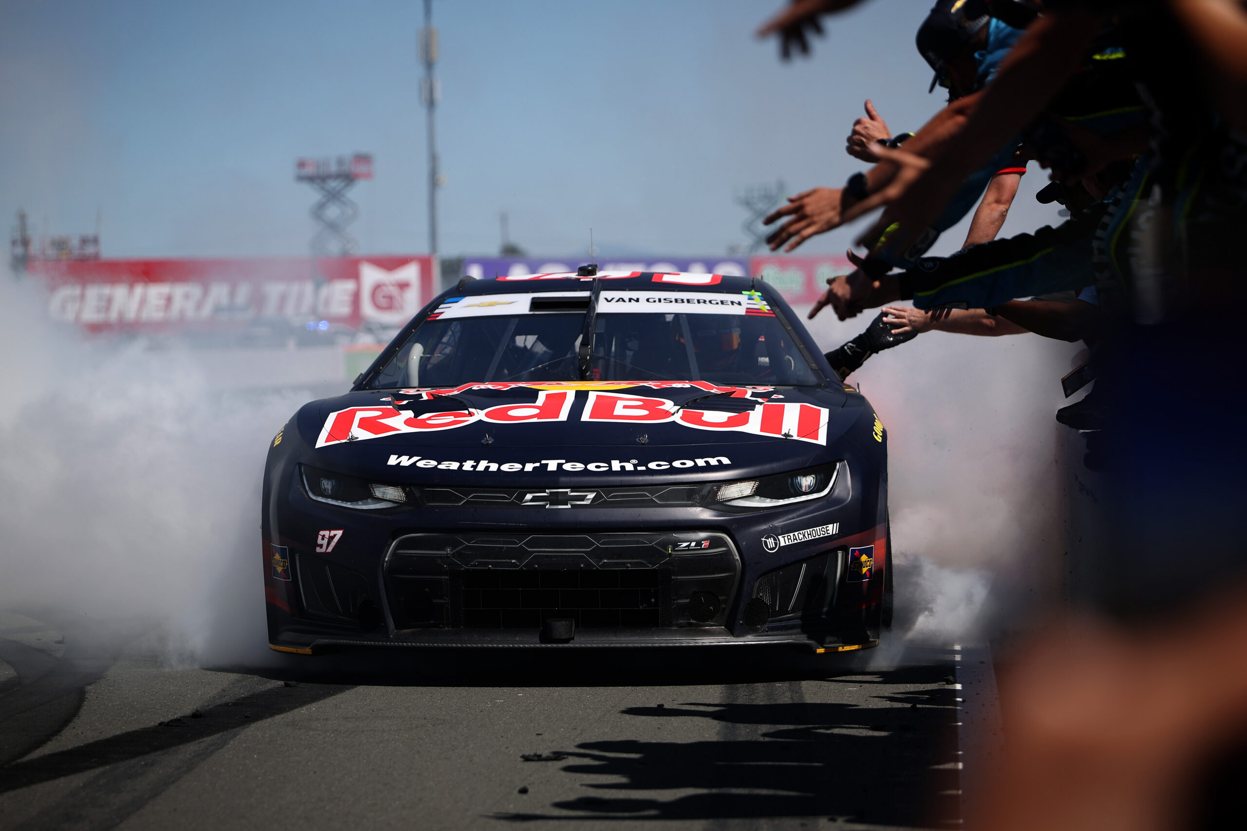SONOMA, CALIFORNIA - JUNE 28: Shane Van Gisbergen, driver of the #97 Red Bull Chevrolet, celebrates with a burnout in front of his crew on the wall after winning the NASCAR Cup Series Toyota/Save Mart 350 at Sonoma Raceway on June 28, 2026 in Sonoma, California. (Photo by James Gilbert/Getty Images)