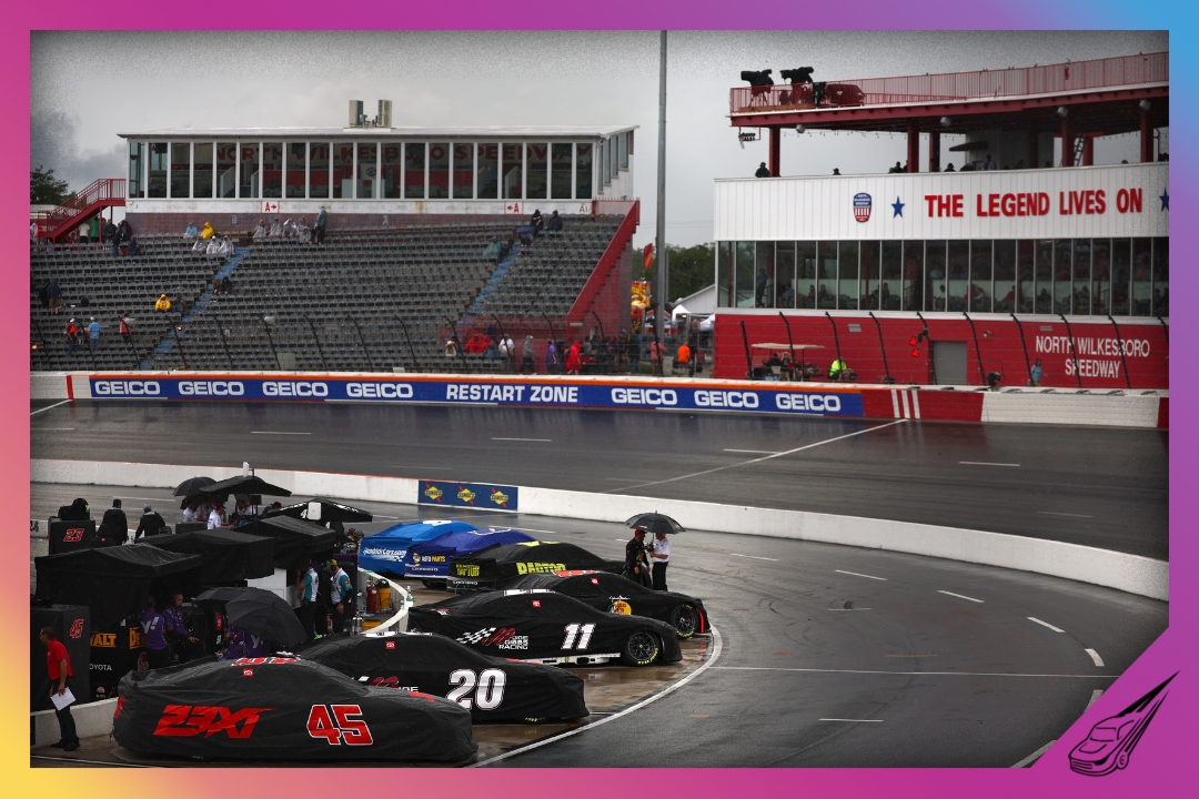 NORTH WILKESBORO, NORTH CAROLINA - MAY 17: A general view of cars covered and parked on the grid during a weather delay in qualifying for the NASCAR Cup Series All-Star Open at North Wilkesboro Speedway on May 17, 2024 in North Wilkesboro, North Carolina. (Photo by Jared C. Tilton/Getty Images)