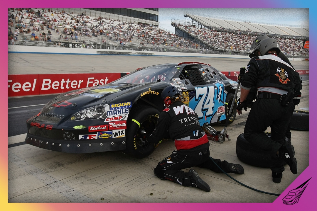 DOVER, DE - SEPTEMBER 25: Jarit Johnson, driver of the #74 Jimmie Johnson Foundation Chevrolet makes a pit stop during the NASCAR Camping World Series East Sunoco 150 at Dover International Speedway on September 25, 2009 in Dover, Delaware. (Photo by Nick Laham/Getty Images)